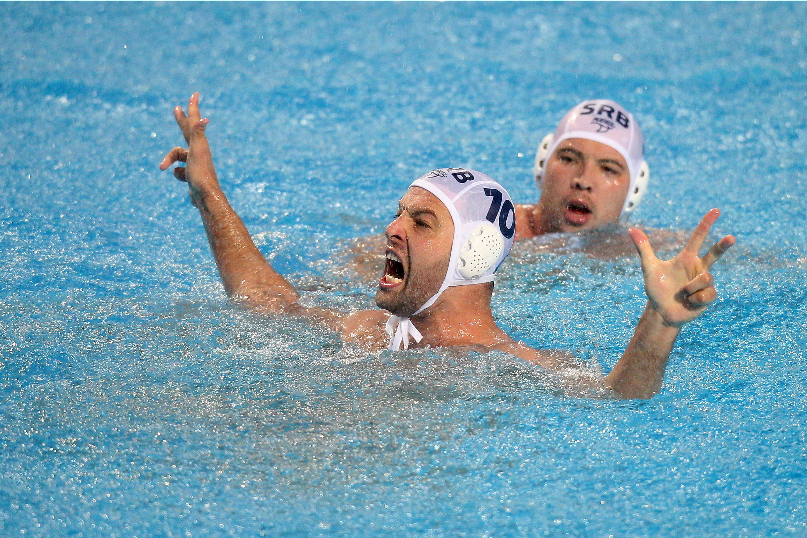 epa07668828 Serbia's Filip Filipovic (L) celebrates after winning the final between Serbia and Croatia at the Water Polo World League Men's Super Final in Belgrade, Serbia, 23 June 2019.  EPA-EFE/MARKO METLAS