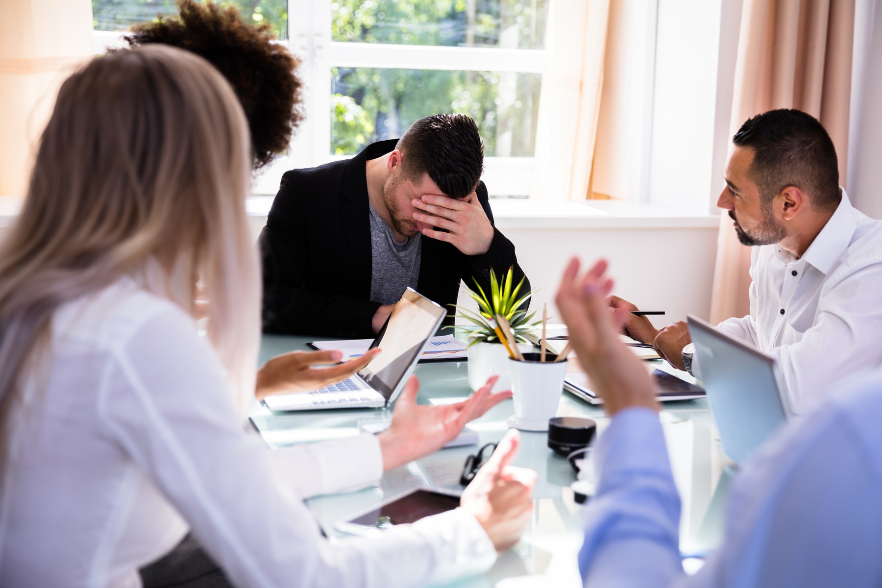 Businesspeople Blaming Their Depressed Young Male Colleague In Office,Image: 390635709, License: Royalty-free, Restrictions: , Model Release: yes, Credit line: Andriy Popov / Panthermedia / Profimedia