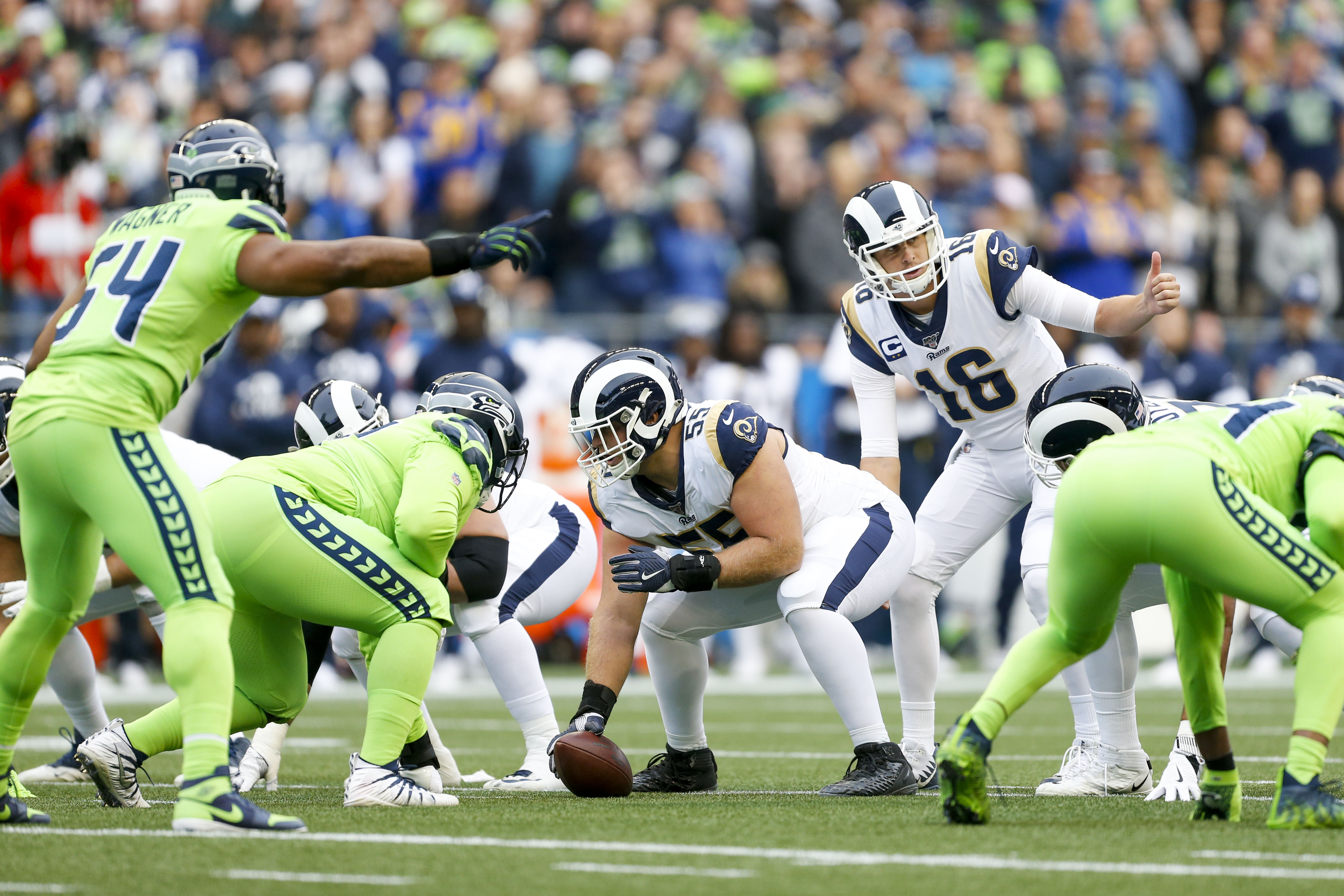 Oct 3, 2019; Seattle, WA, USA; Los Angeles Rams quarterback Jared Goff (16) stands over center Brian Allen (55) against the Seattle Seahawks during the first quarter at CenturyLink Field. Mandatory Credit: Joe Nicholson-USA TODAY Sports - 13456130