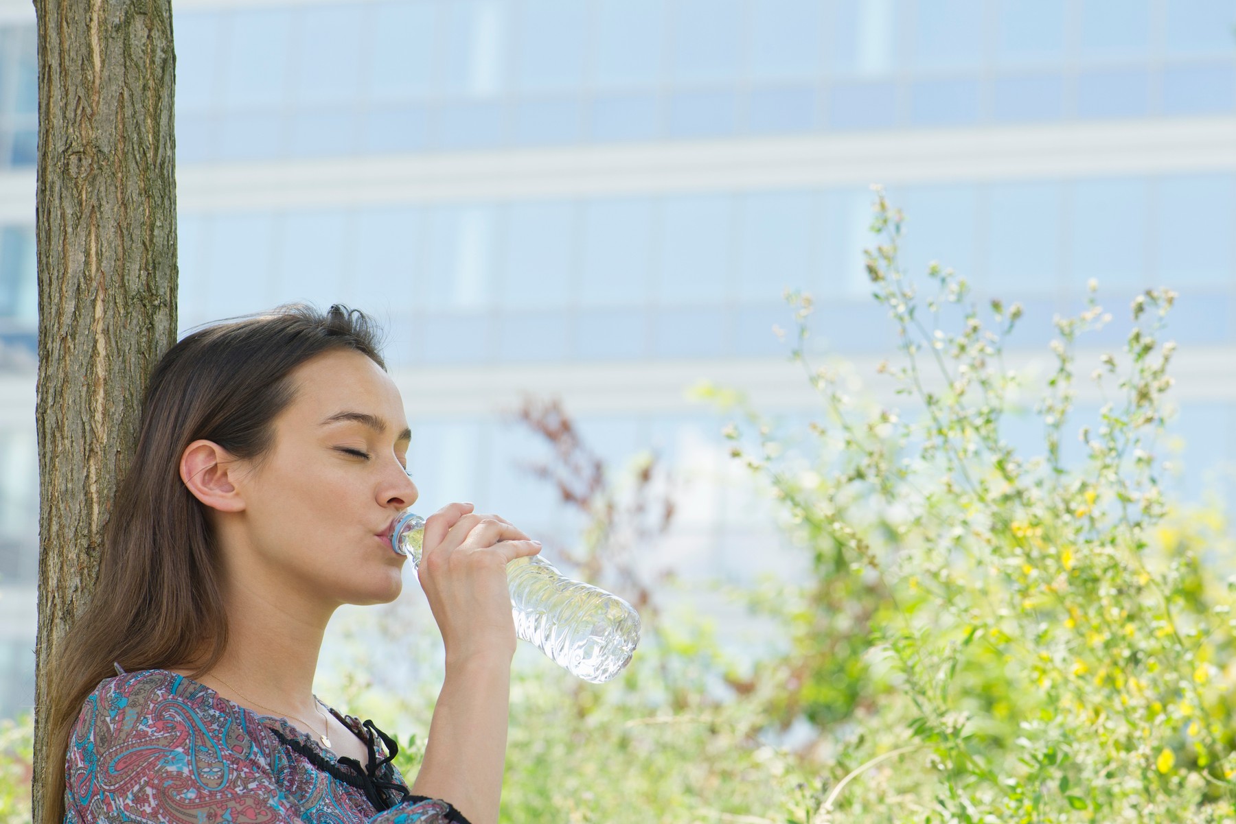 Woman drinking bottled water outdoors,Image: 295623354, License: Royalty-free, Restrictions: , Model Release: yes, Credit line: - / PhotoAlto / Profimedia