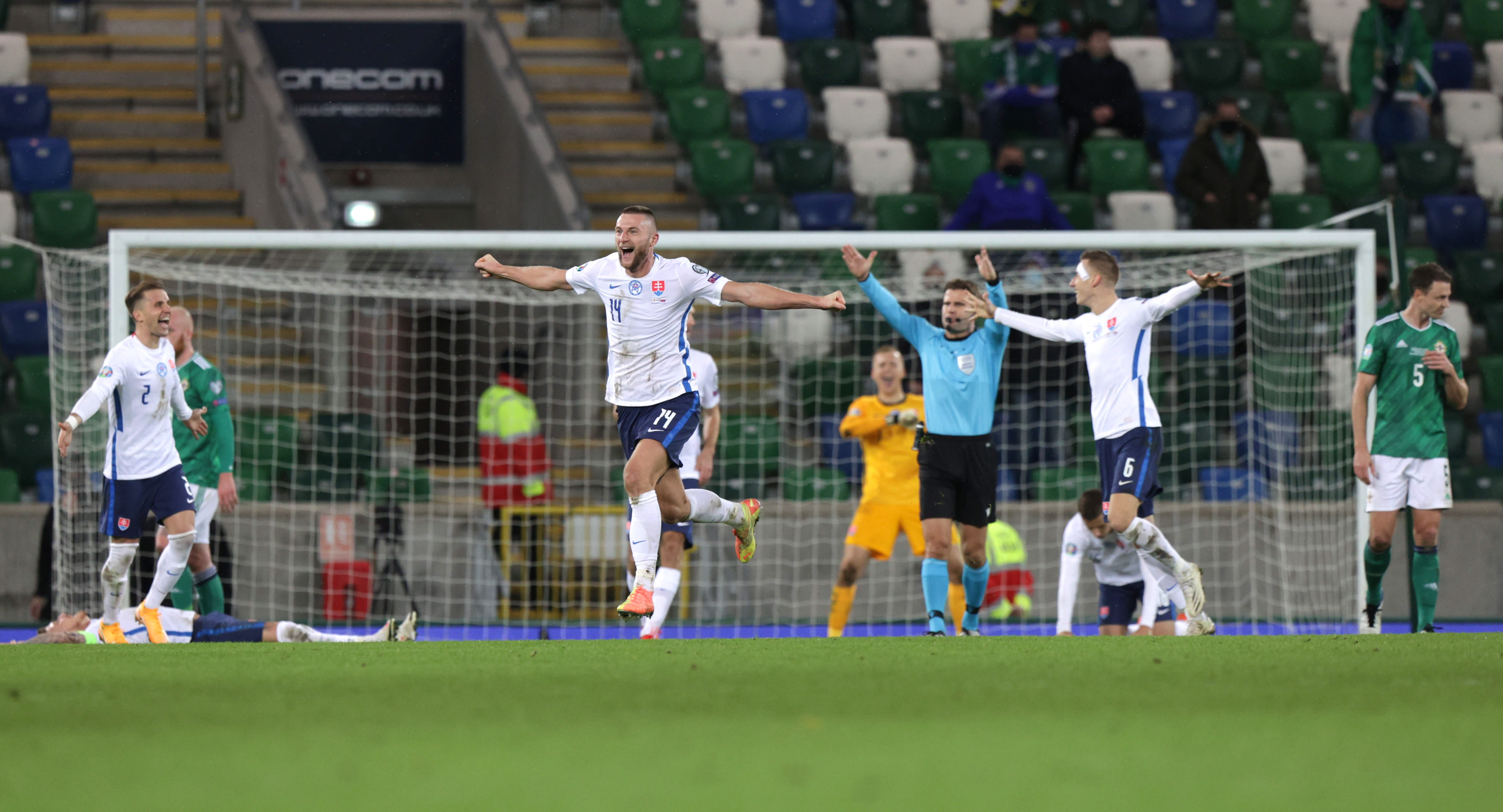 epa08816818 Slovakia's Milan Skriniar (C) reacts after his team wins 1-2 during the UEFA EURO 2020 play-off soccer match between Northern Ireland and Slovakia at Windsor Park stadium in Belfast Northern Ireland, 12 November 2020.  EPA-EFE/JOHN MCVITTY
