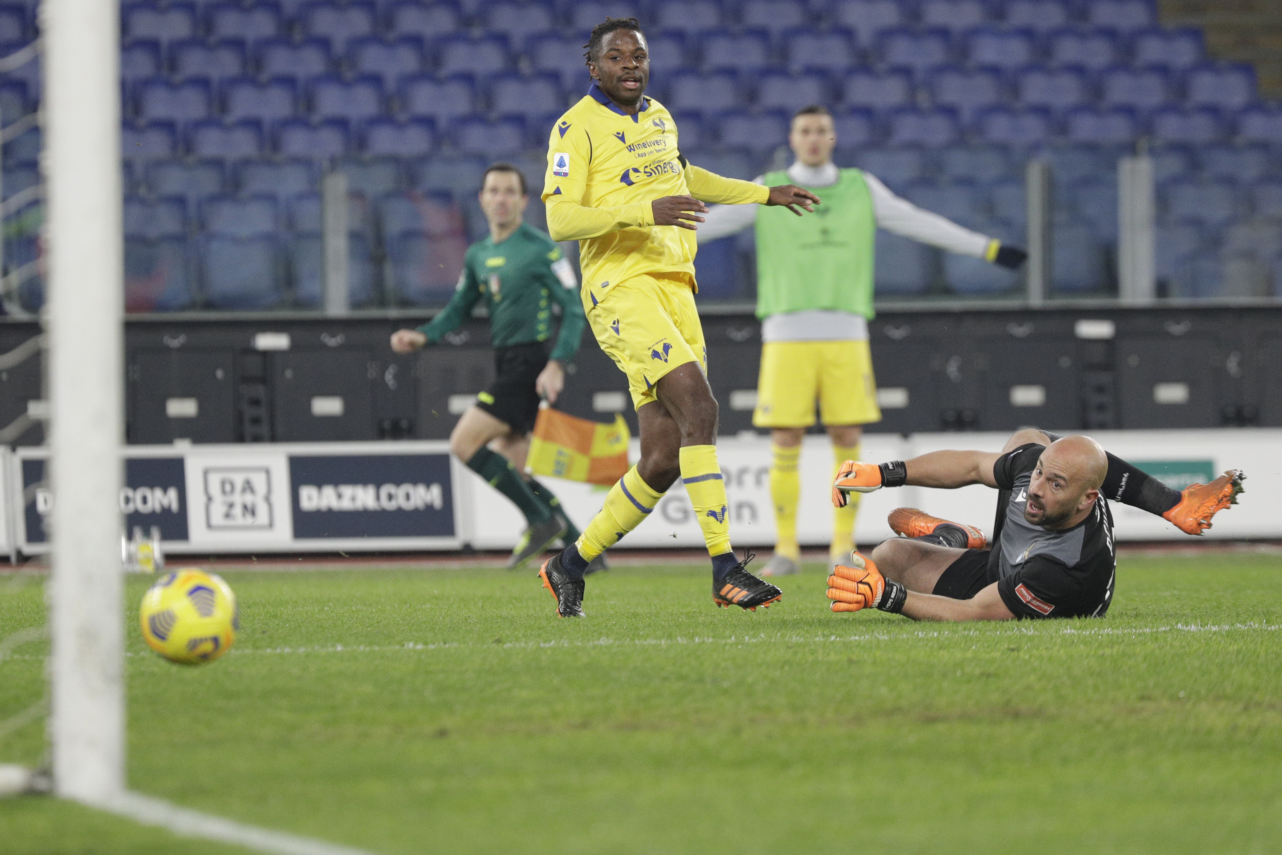 Verona's Adrien Tameze, left, scores during the Italian Serie A soccer match between Lazio and Verona at Rome's Olympic stadium, Saturday, Dec.12, 2020. (AP Photo/Gregorio Borgia)