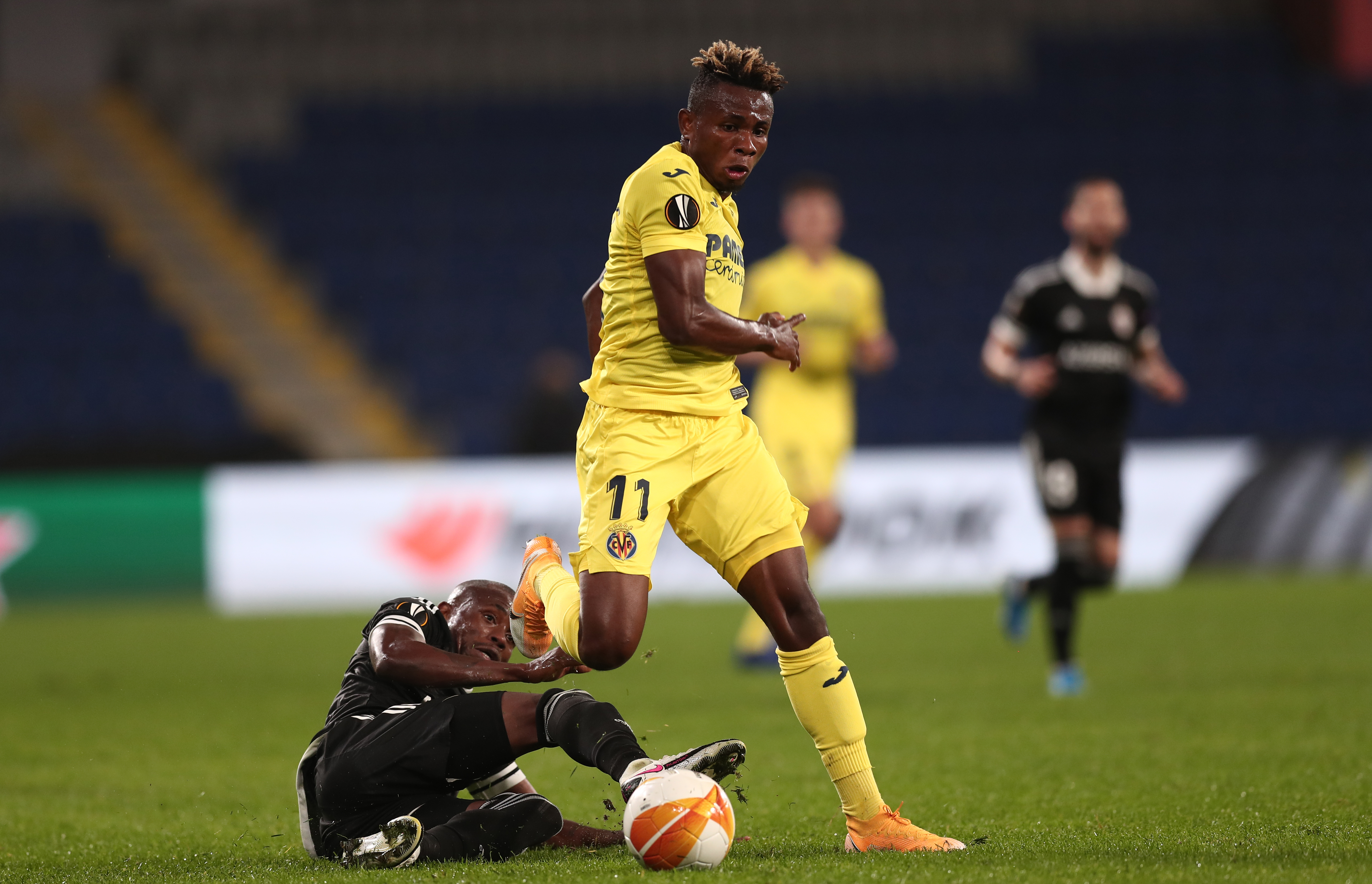 epa08784252 Qarabag's Donald Guerrier (down) in action against Villareal's Samu Chukwueze (up)  during the UEFA Europa League Group I match between Qarabag and Villareal in Istanbul, Turkey, 29 October 2020.  EPA-EFE/SEDAT SUNA