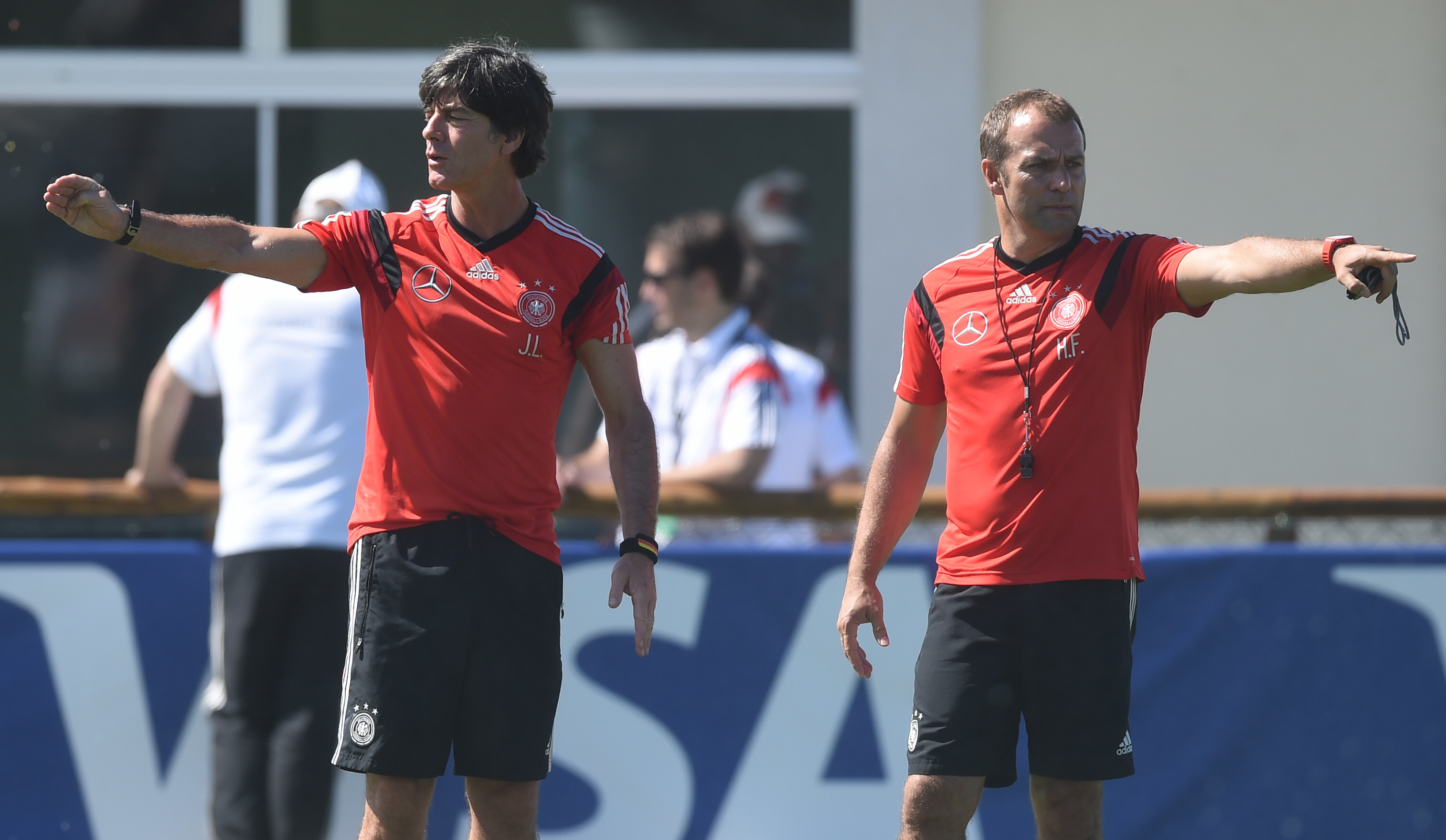 epa04262816 Head coach Joachim Loew (L) and assistant coach Hans-Dieter Flick in action during a training session of the German national soccer team at the training center in Santo Andre, Brazil, 17 June 2014.  EPA/MARCUS BRANDT