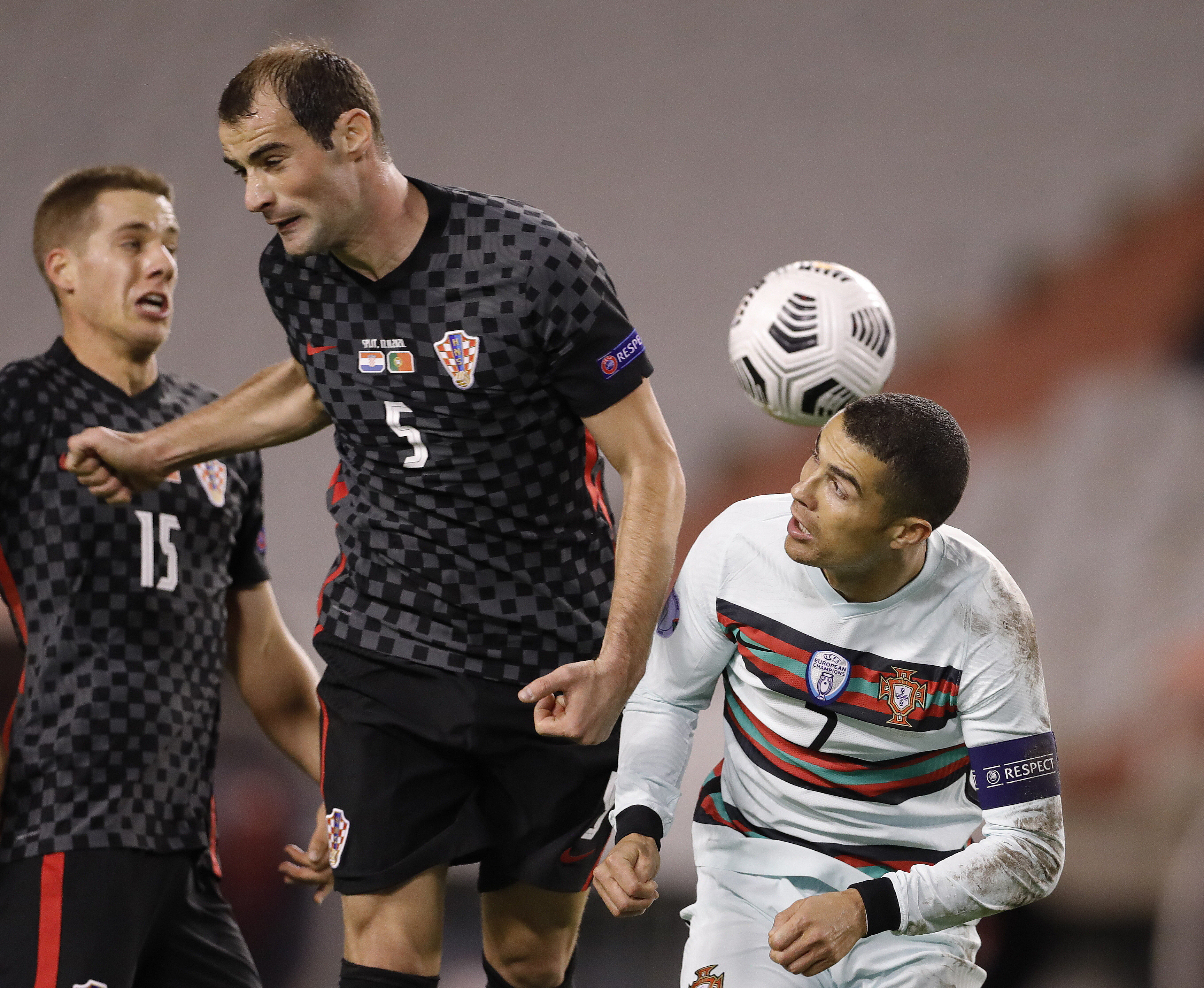 epa08826136 Croatia's Mile Skoric (L) in action against Cristiano Ronaldo of Portugal during the UEFA Nations League, League A, group 3 soccer match, between Croatia and Portugal in Split, Croatia, 17 November 2020.  EPA-EFE/ANTONIO BAT