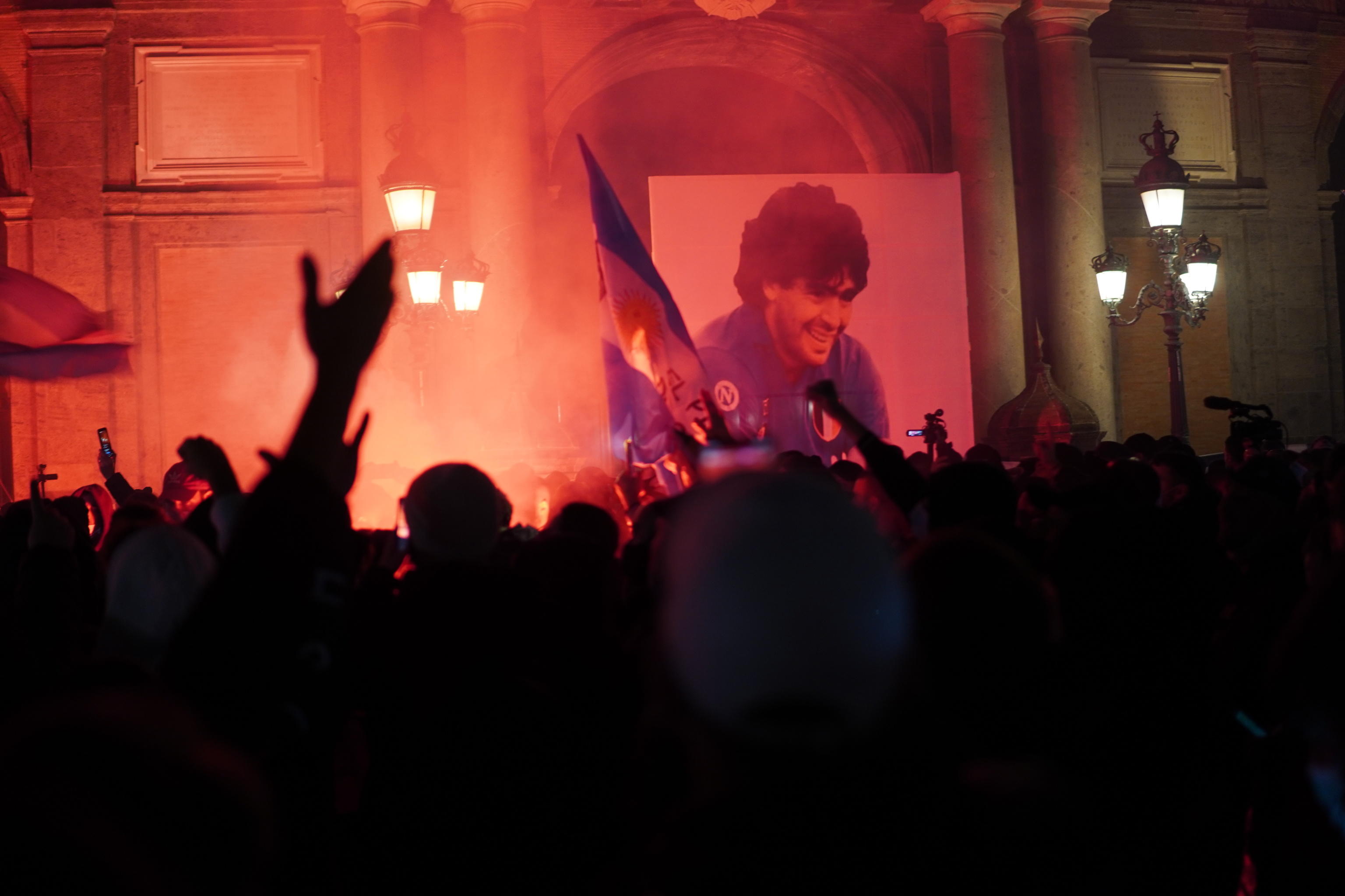 epa08844686 Procession and torchlight of Napoli's supporters in memory of Diego Armando Maradona in Naples, Italy, 26 November 2020. Soccer legend Diego Maradona died on 25 November at the age of 60 after a heart attack.  EPA-EFE/CESARE ABBATE