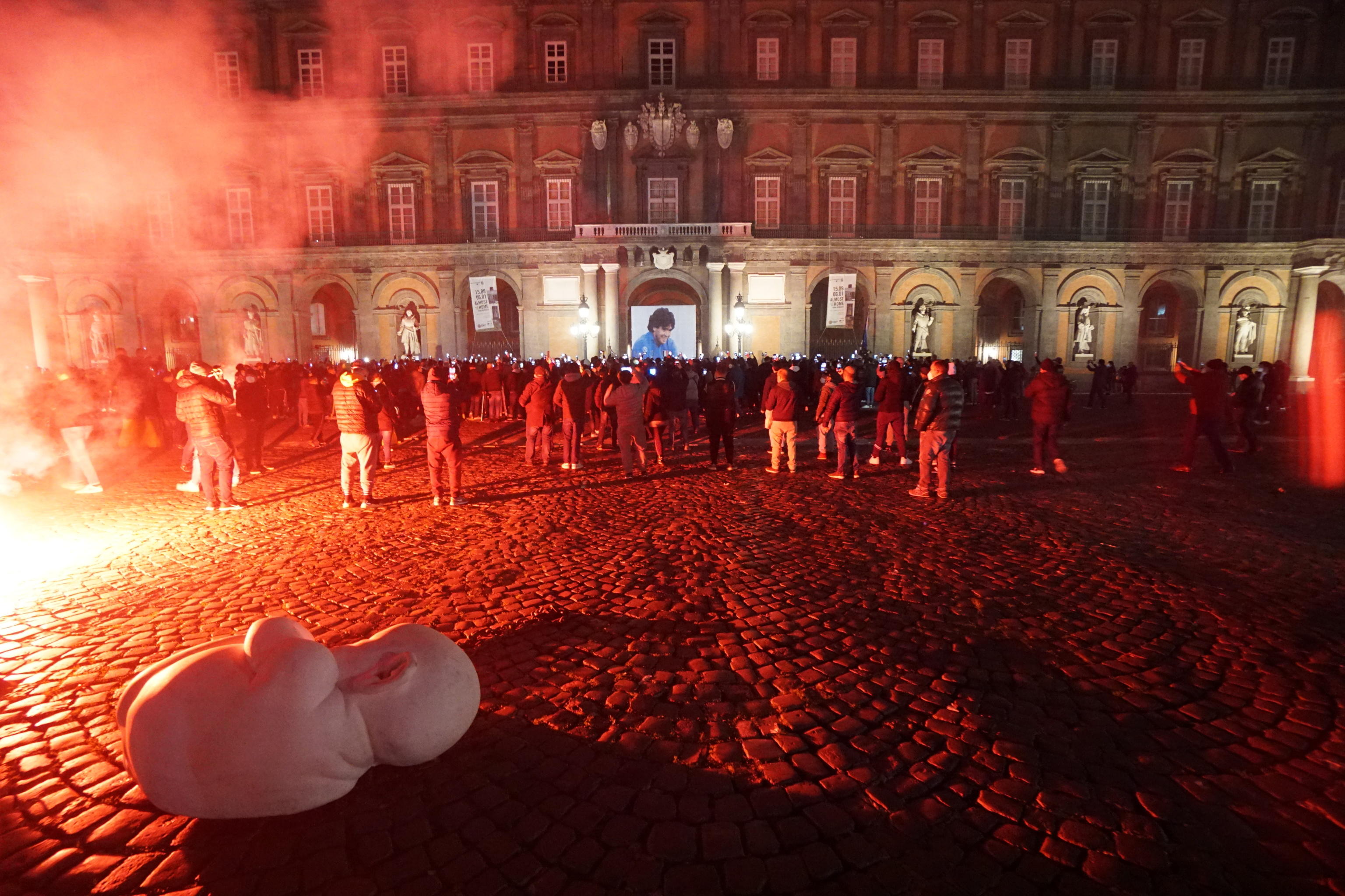 epa08844682 Procession and torchlight of Napoli's supporters in memory of Diego Armando Maradona in Naples, Italy, 26 November 2020. Soccer legend Diego Maradona died on 25 November at the age of 60 after a heart attack.  EPA-EFE/CESARE ABBATE