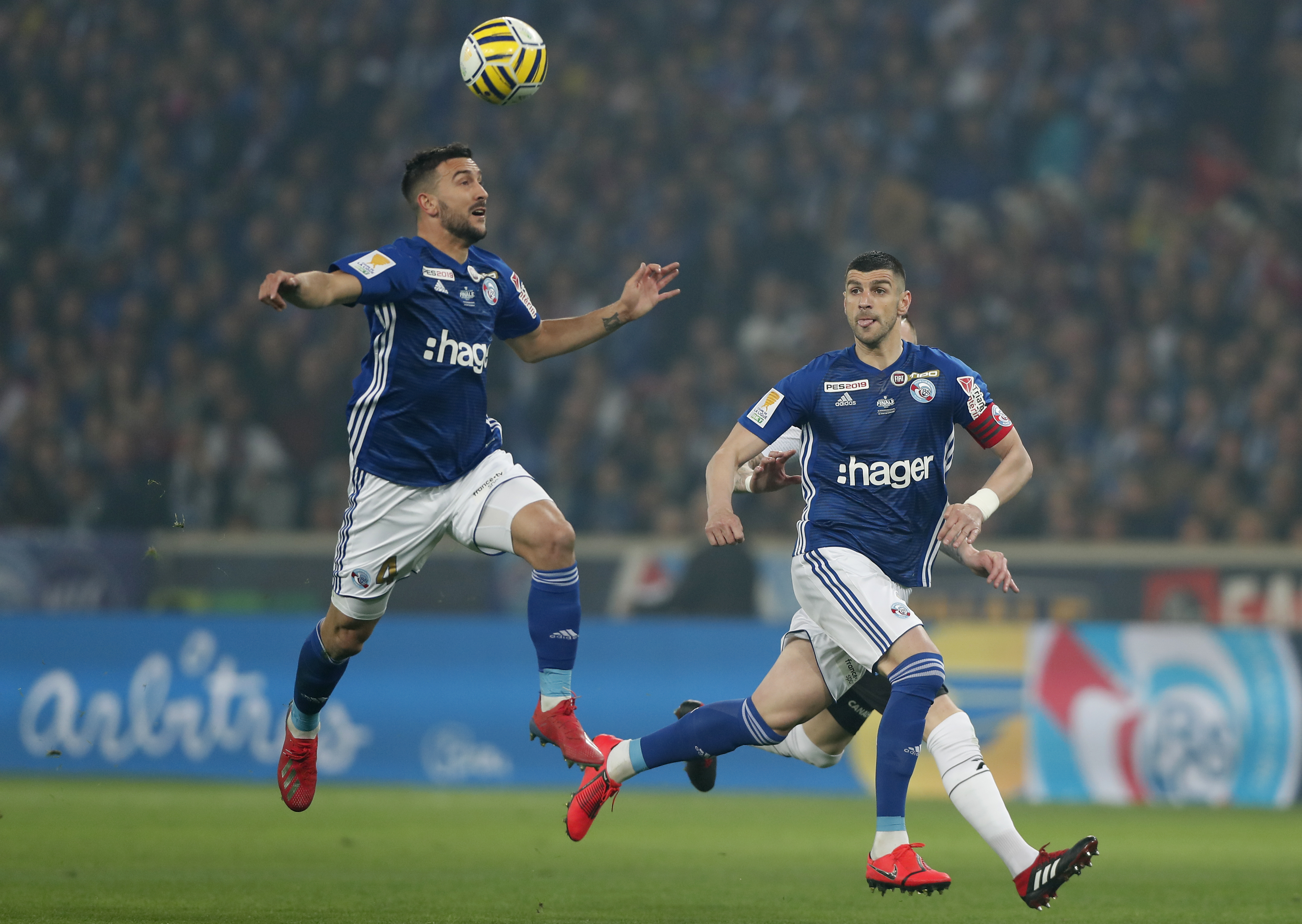 epa07474532 Pablo Martinez of Strasbourg (L) and Stefan Mitrovic of Strasbourg (R) in action during the Coupe de la Ligue final match between Strasbourg and Guingamp, in Lille, France, 30 March 2019.  EPA-EFE/IAN LANGSDON
