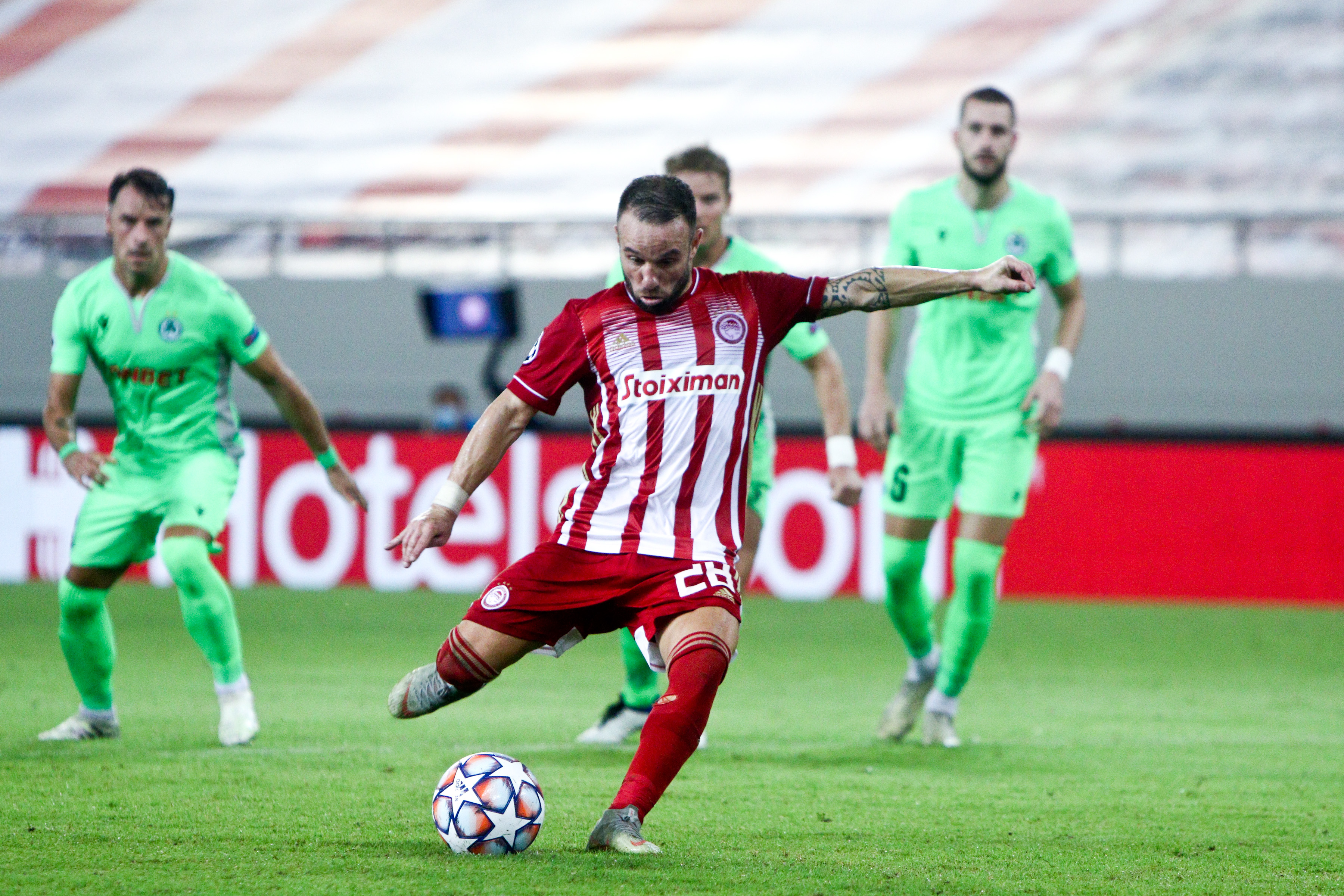 epa08692211 Mathieu Valbuena of Olympiacos scores the 1-0 lead from the penalty spot during the UEFA Champions League playoff first leg soccer match between Olympiacos FC and Omonoia FC, in Piraeus, Greece, 23 September 2020.  EPA-EFE/Georgia Panagopoulou