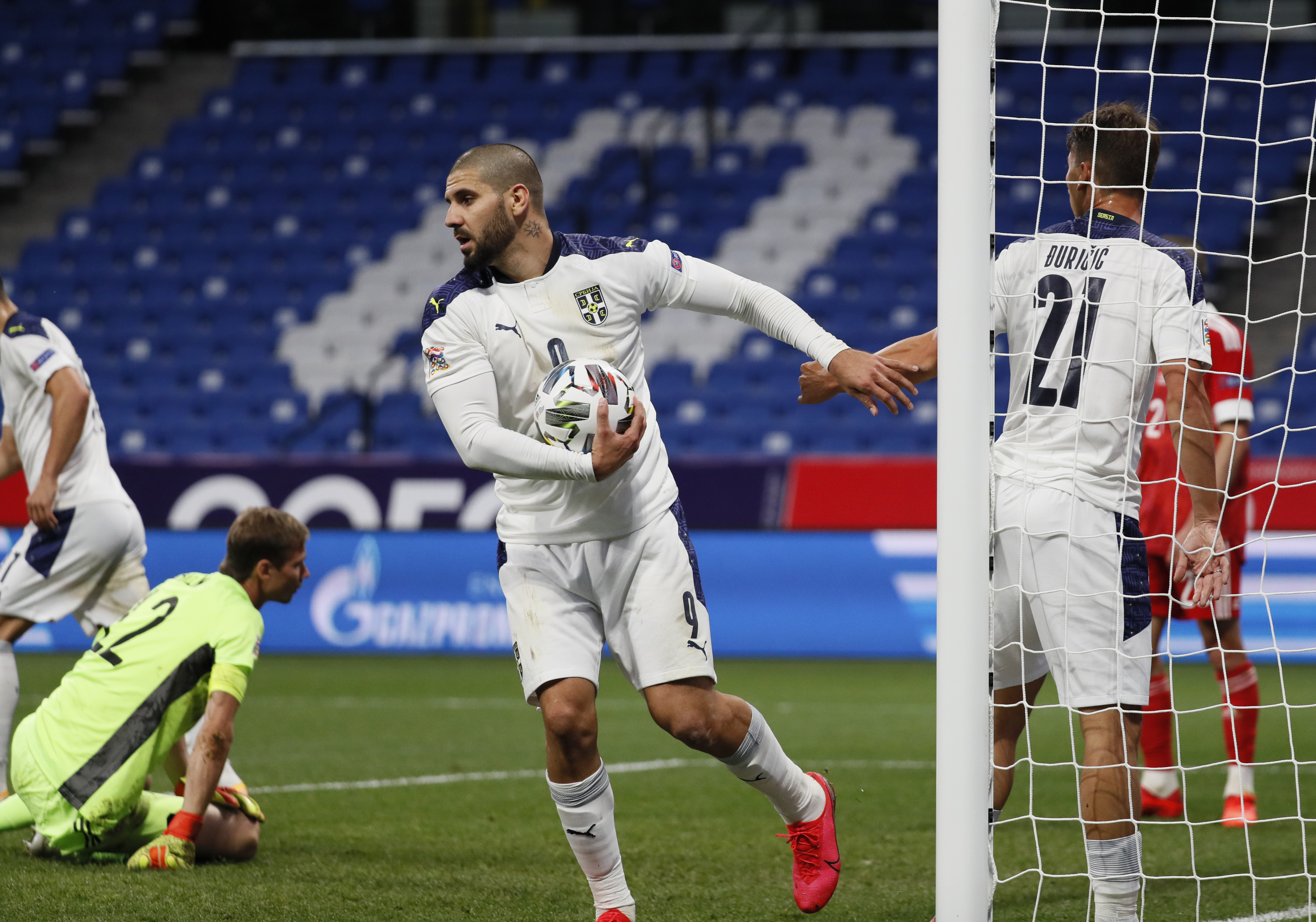 epa08644869 Aleksandar Mitrovic (C) and Filip Djuricic (R) of Serbia celebrate the 2-1 goal during the UEFA Nations League Group stage match between Russian and Serbia in Moscow, Russia, 03 September 2020.  EPA-EFE/YURI KOCHETKOV
