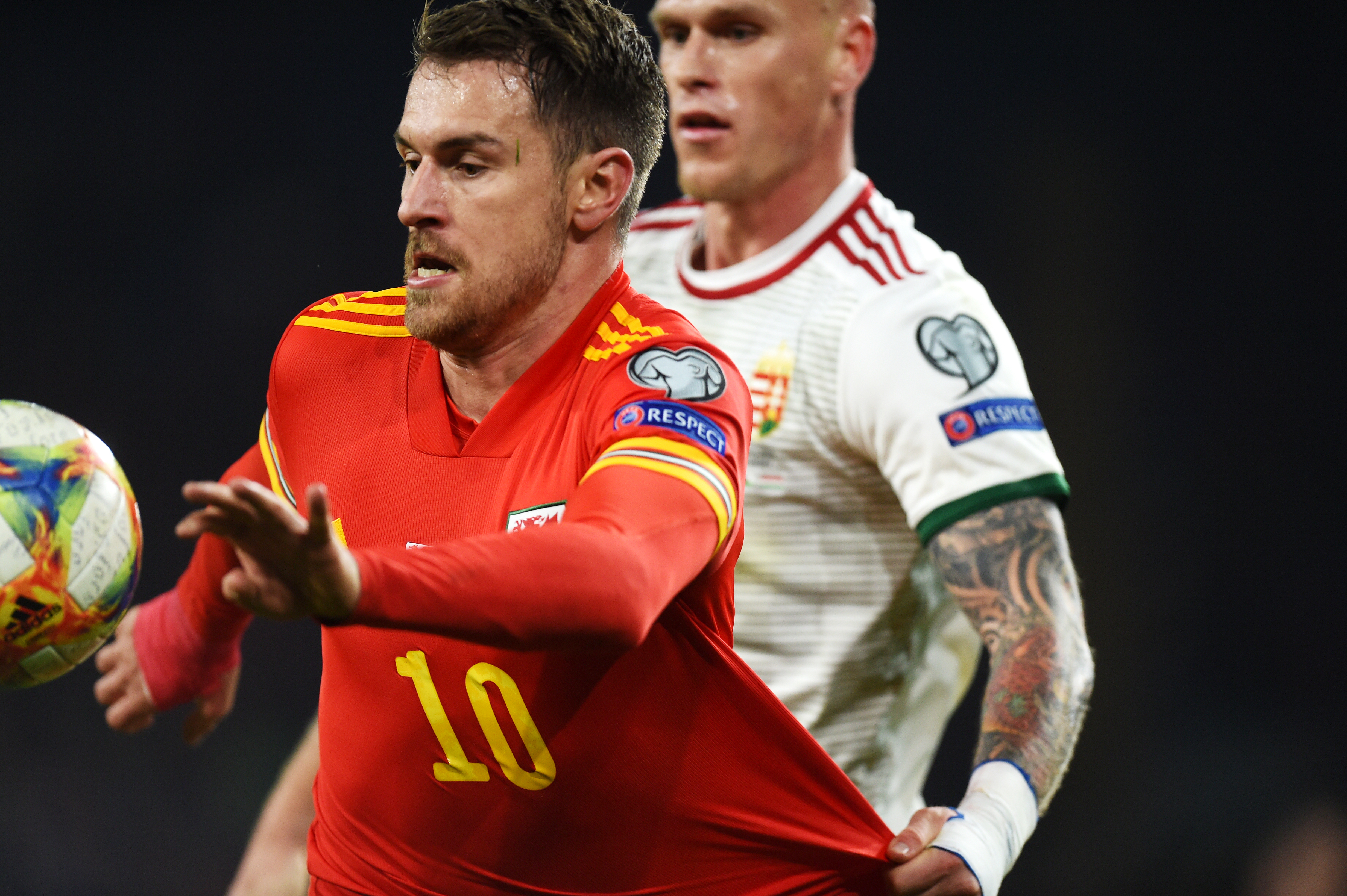 epa08009826 Aaron Ramsey (L) of Wales in action against Botond Barath of Hungary during the UEFA EURO 2020 Group E qualification match between Wales and Hungary in Cardiff, Wales, Britain, 19 November 2019.  EPA-EFE/PETER POWELL
