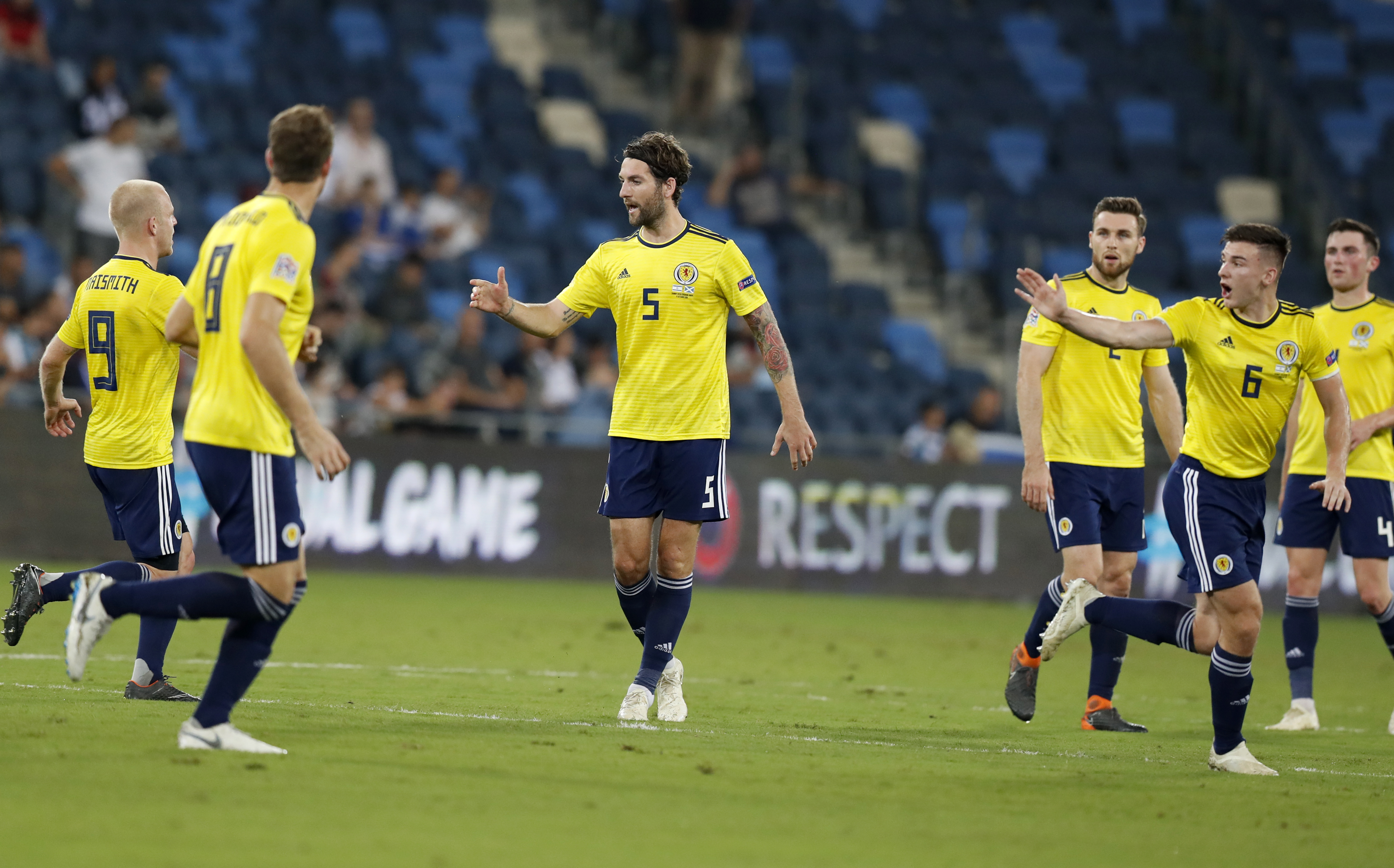 epa07086673 Charlie Mulgrew (C) of Scotland celebrate his goal  during the UEFA Nations League soccer match between Israel and Scotland at Sammy Ofer Stadium in Haifa, Israel, 11 October 2018.  EPA-EFE/ATEF SAFADI