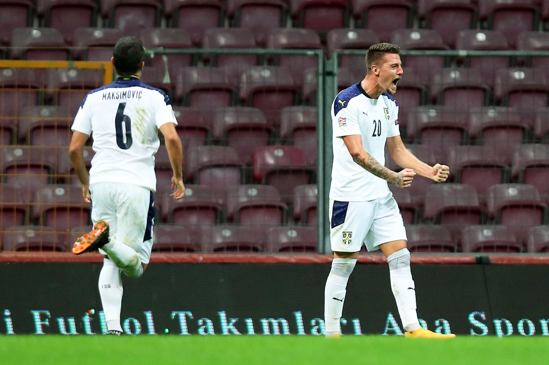 epa08745260 Sergej Milinkovic-Savic (R) of Serbia celebrates after scoring the 1-0 lead during the UEFA Nations League soccer match between Turkey and Serbia in Istanbul, Turkey, 14 October 2020.  EPA-EFE/TOLGA BOZOGLU