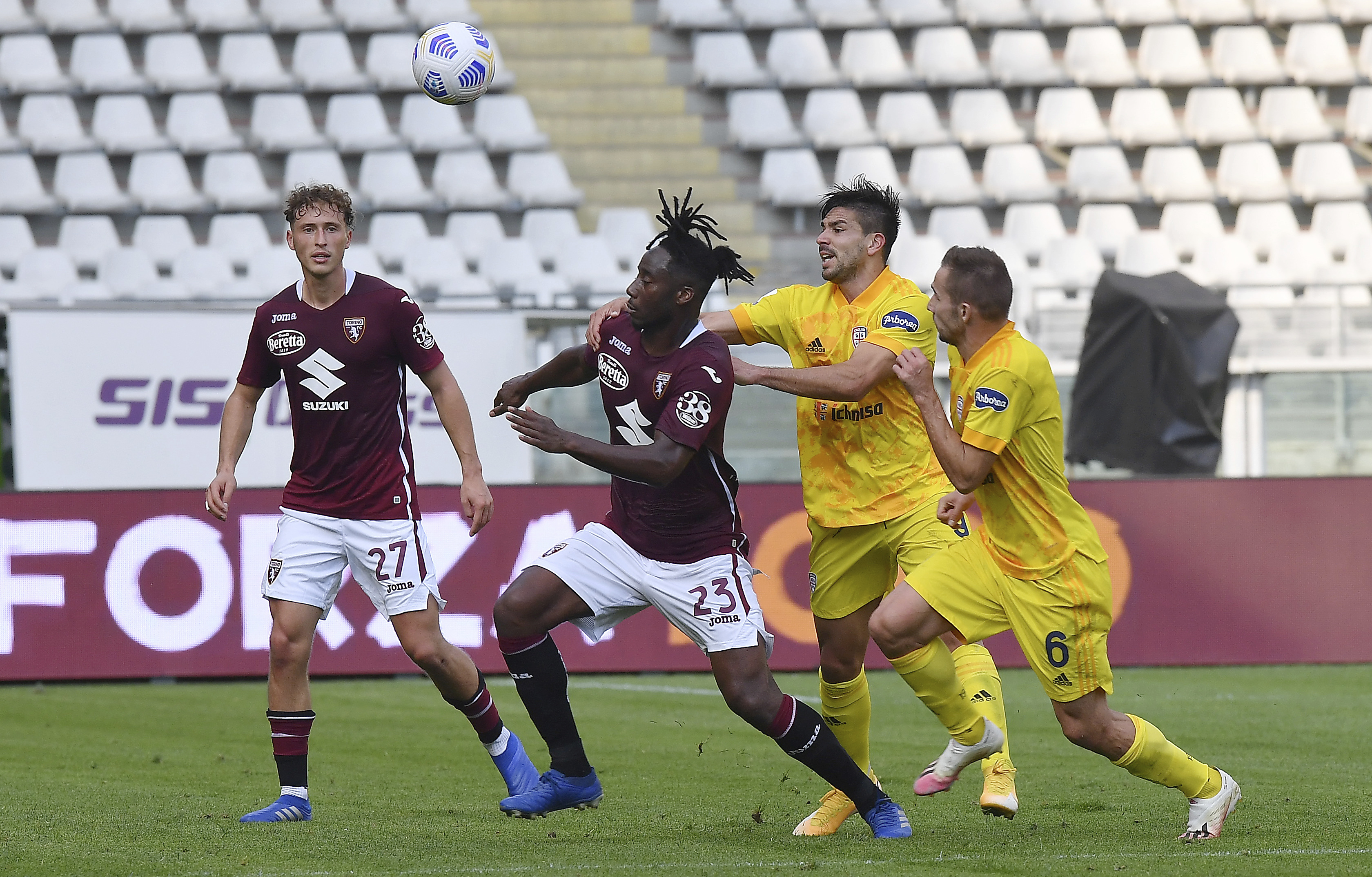Torino's Soualiho Meité vies for the ball with Cagliari's Razvan Marin during the Italian Serie A match between Torino and Cagliari, at the Olimpico Grande Torino stadium in Turin, Italy, Sunday, Oct. 18, 2020.  (Tano Pecoraro/LaPresse via AP)