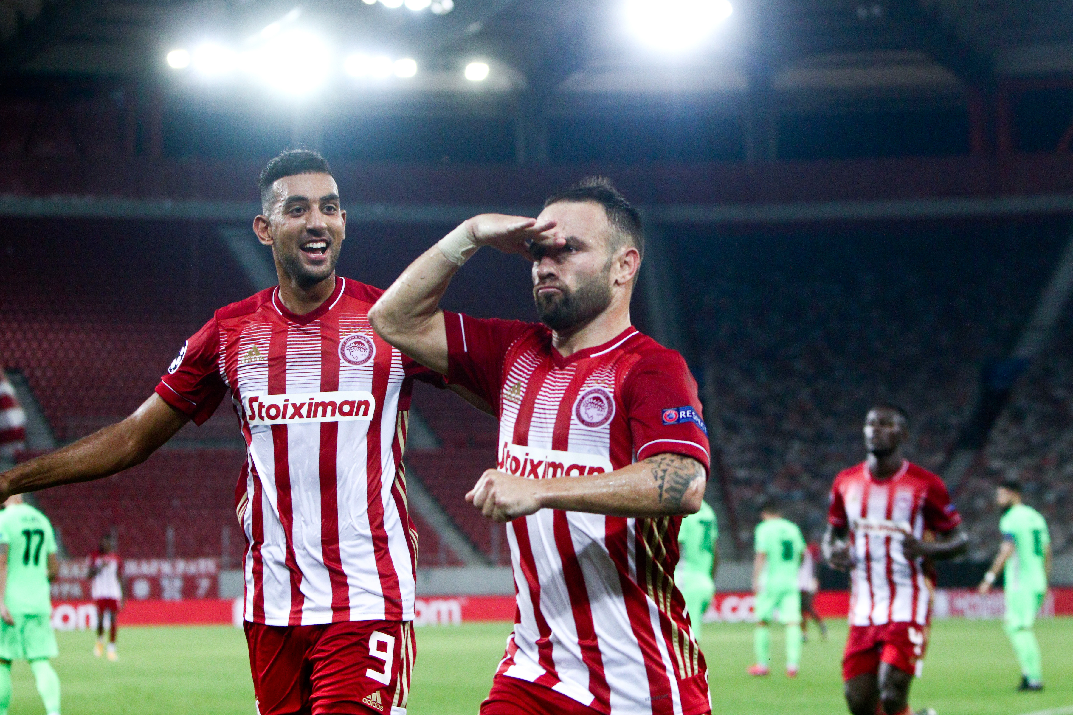 epa08692158 Mathieu Valbuena (C) of Olympiacos celebrates a goal during the UEFA Champions League playoff first leg soccer match between Olympiacos FC and Omonoia FC, in Piraeus, Greece, 23 September 2020.  EPA-EFE/Georgia Panagopoulou