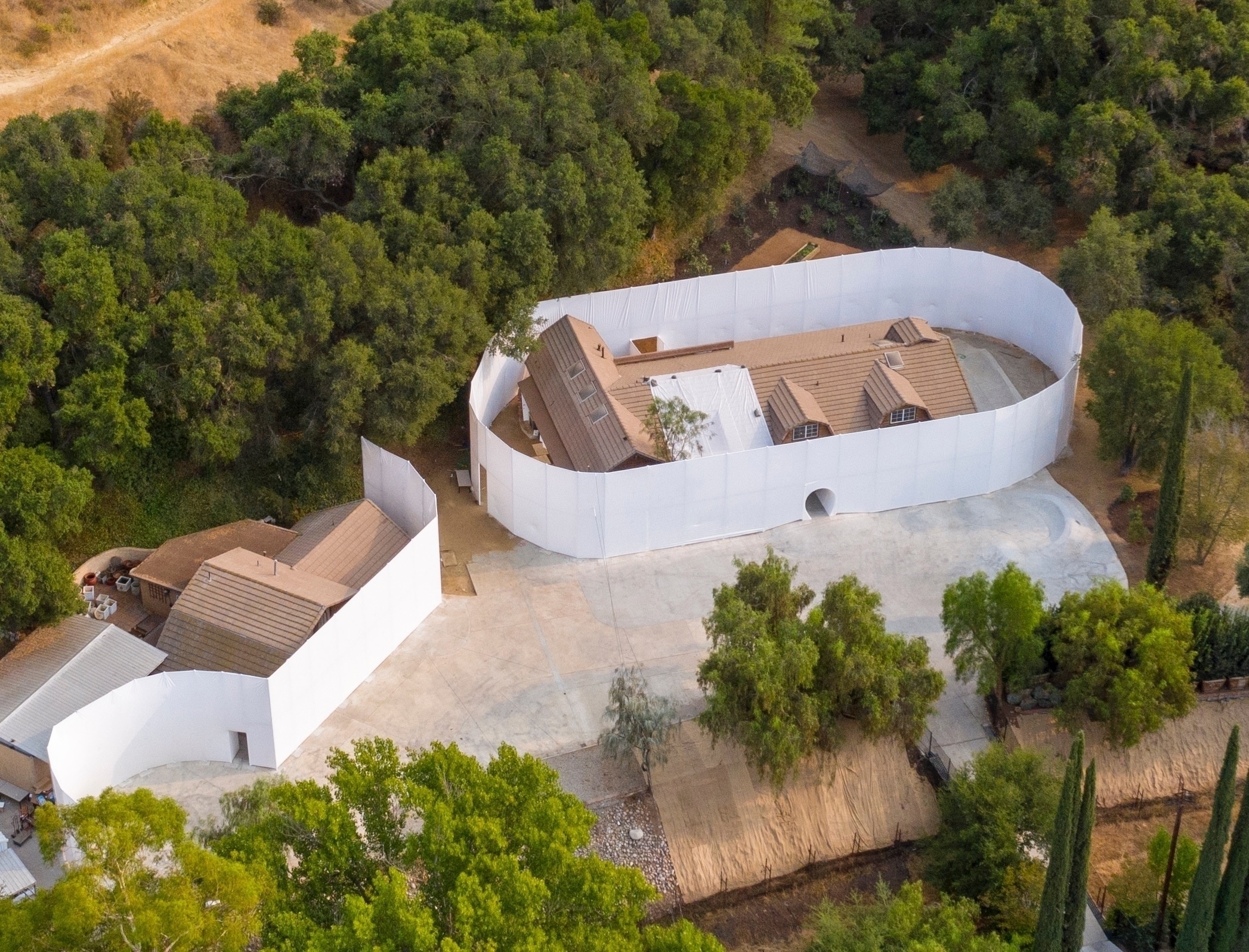 *EXCLUSIVE* Kanye West has built a white wall around his ranch house where he has his church