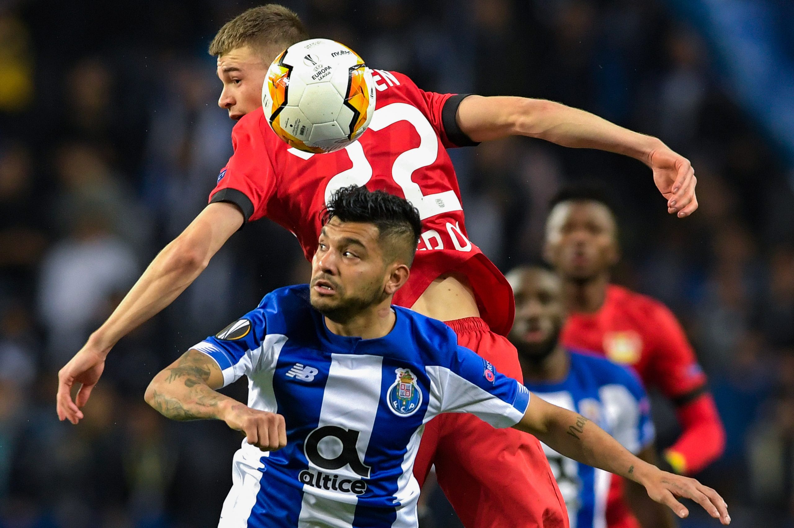 epa08253395 FC Porto's Jesus Corona (L) vies for the ball with Bayer Leverkusen's Daley Sinkgraven during their UEFA Europa League round of 32, 2nd leg, soccer match held at Dragao Stadium in Porto, Portugal, 27 February 2020.  EPA-EFE/FERNANDO VELUDO