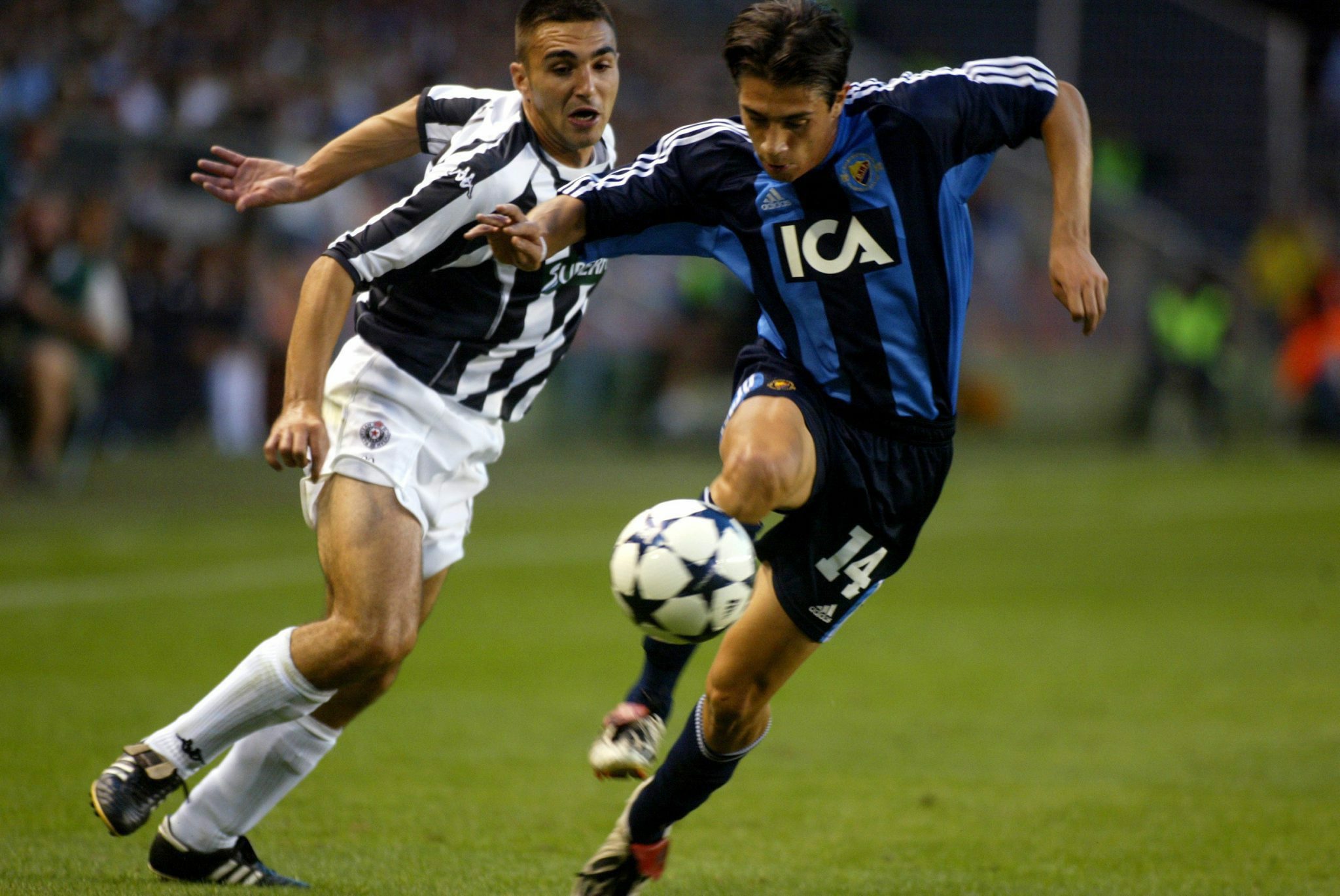 Babis Stefanidis of Swedish Djurgarden Stockholm (L) controlls the ball in front of Nikola Malbasa of Serbian Partizan Belgrade