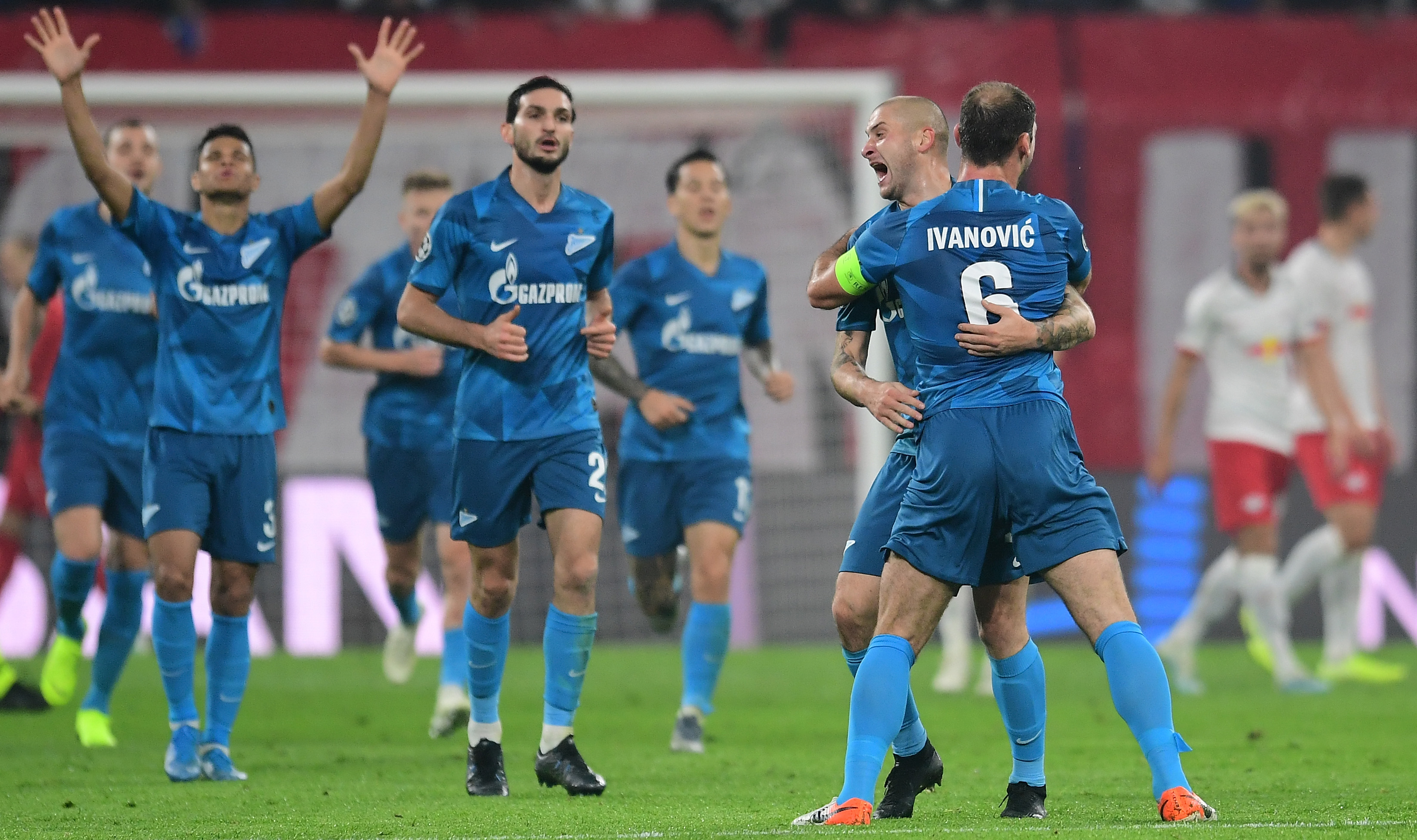 epa07943699 Zenit's Yaroslav Rakitskiym (2-R) celebrates scoring the first goal with Zenit's Branislav Ivanovic (R) during the UEFA Champions League match between RB Leipzig vs Zenit St.Petersburg in Leipzig, Germany 23 October 2019.  EPA-EFE/FILIP SINGER