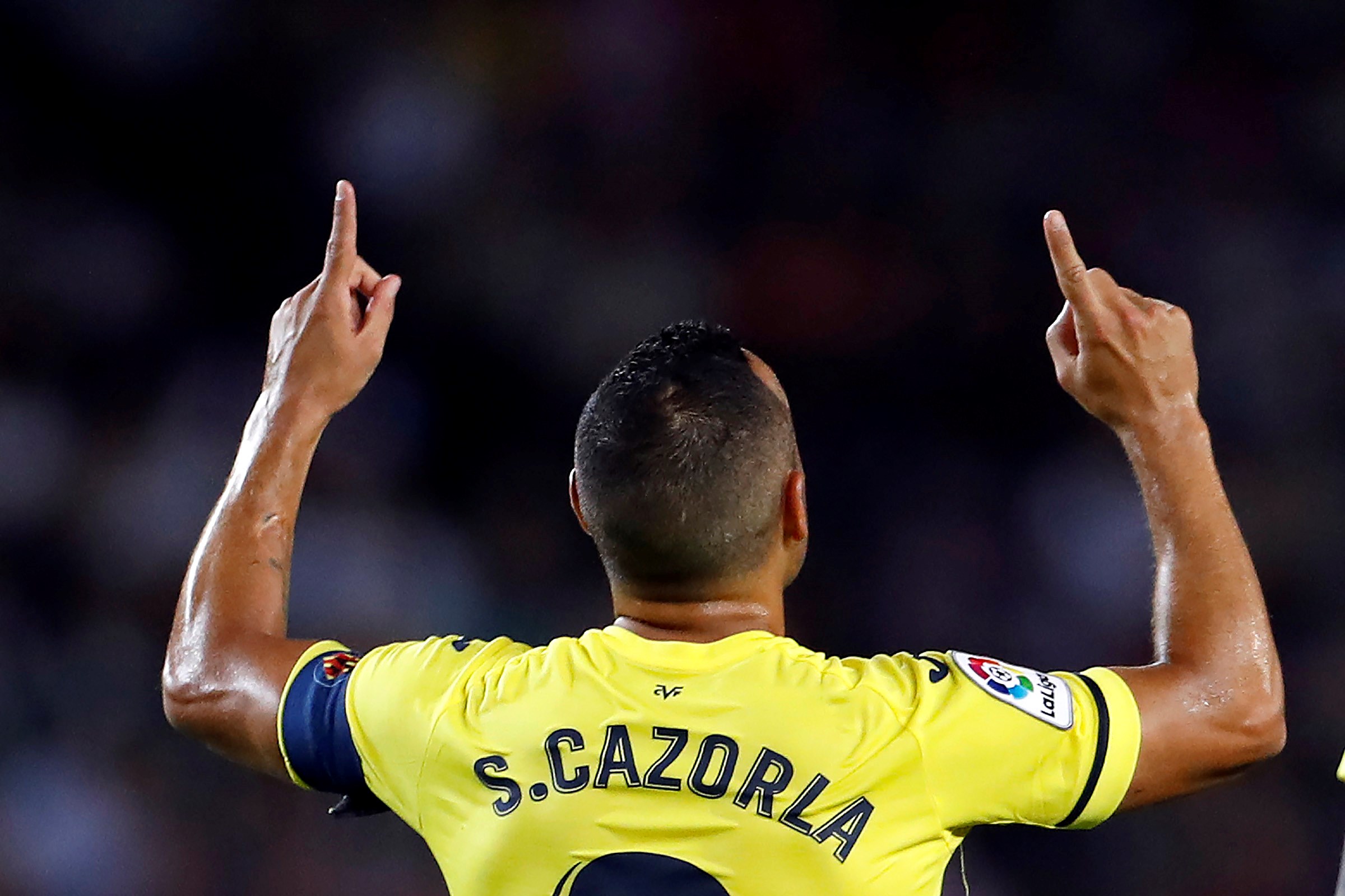 epa07867125 Villarreal's midfielder Santi Cazorla celebrates after scoring the 2-1 during the Spanish LaLiga match between FC Barcelona and Villarreal CF at Camp Nou stadium in Barcelona, Catalonia, Spain, 24 September 2019.  EPA-EFE/Alberto Estevez