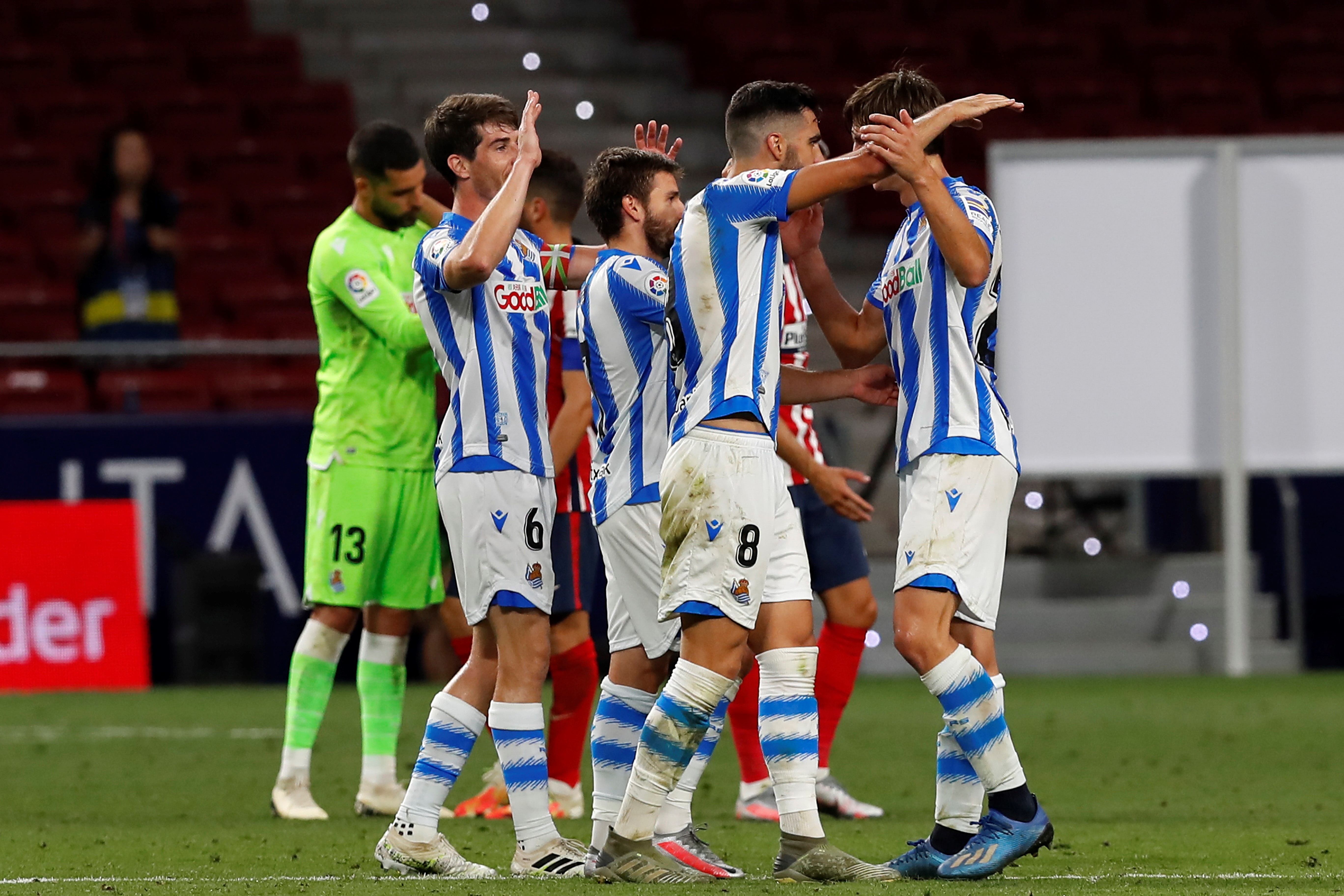 epa08555731 Real Sociedad's players celebrates after scoring the 1-1 goal during the Spanish LaLiga soccer match between Atletico Madrid and Real Sociedad held at Wanda Metropolitano stadium, in Madrid, Spain, 19 July 2020.  EPA-EFE/CHEMA MOYA