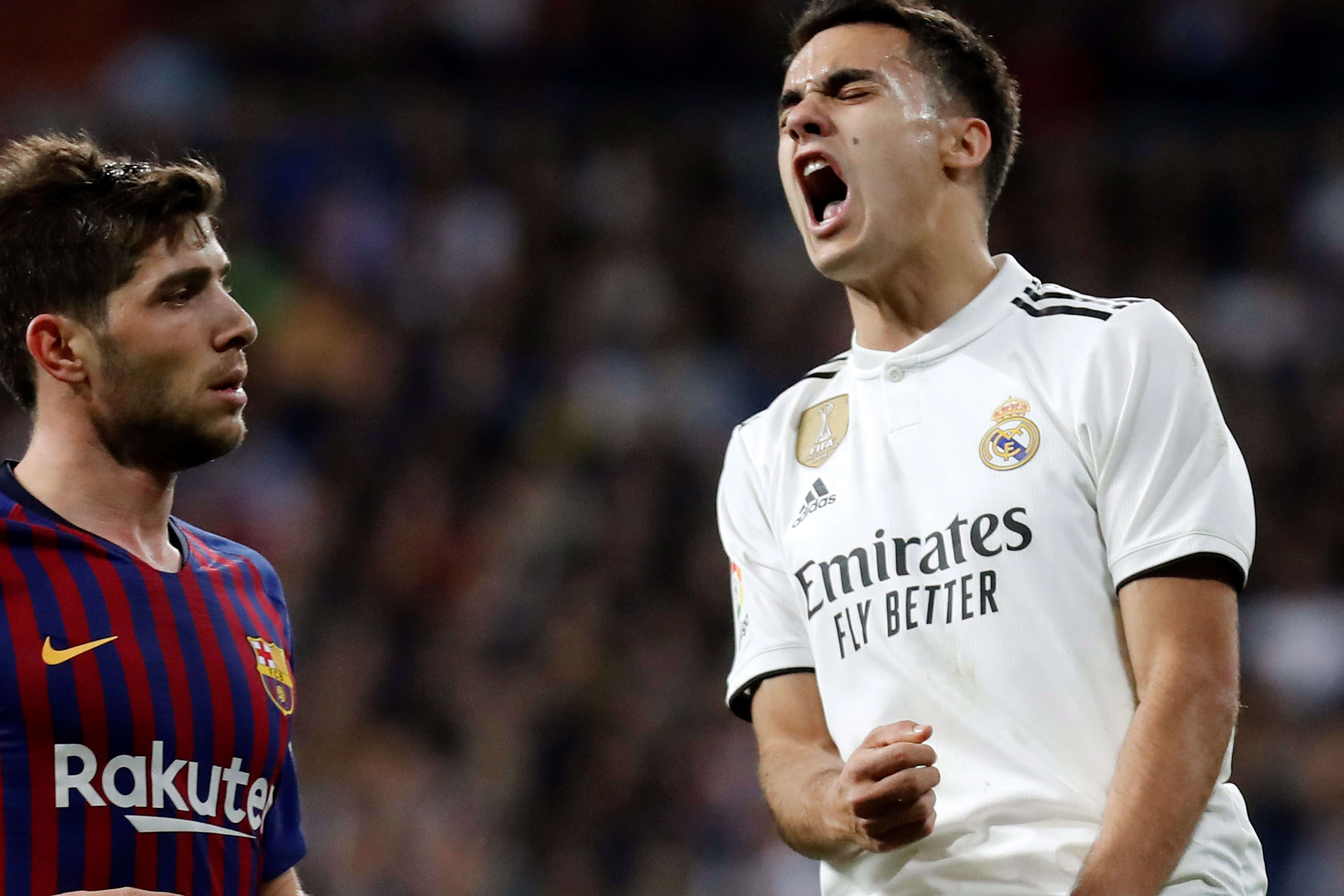 epa07409783 Real Madrid's Sergio Reguilon (R) reacts during a Spanish LaLiga soccer match between Real Madrid and FC Barcelona at the Santiago Bernabeu stadium in Madrid, Spain, 02 March 2019.  EPA-EFE/Juan Carlos Hidalgo