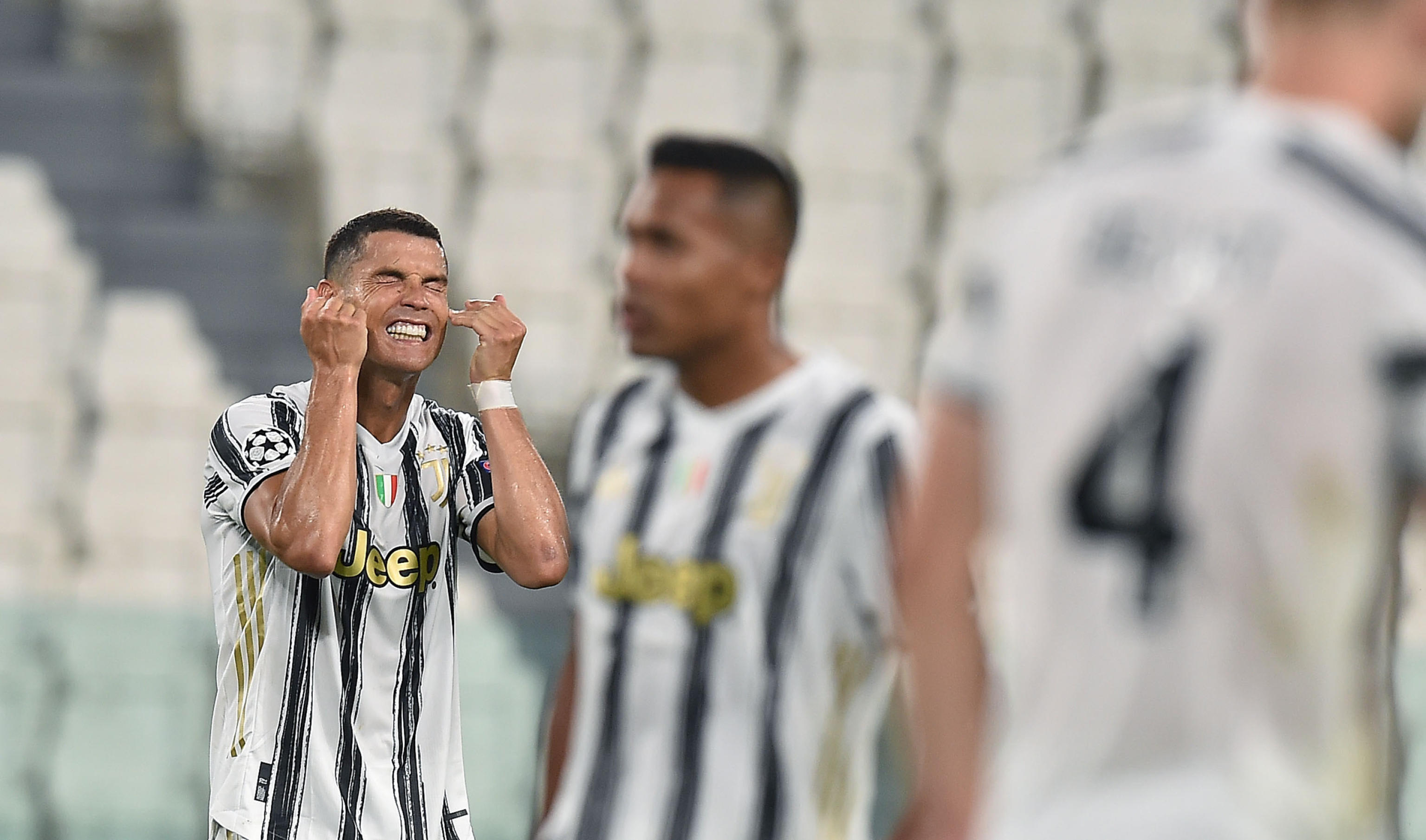 epa08590748 Juventus? Cristiano Ronaldo (L) reacts during the UEFA Champions League round of 16 second leg soccer match Juventus FC vs Olympique Lyon at the Allianz Stadium in Turin, Italy, 07 August 2020.  EPA-EFE/ALESSANDRO DI MARCO