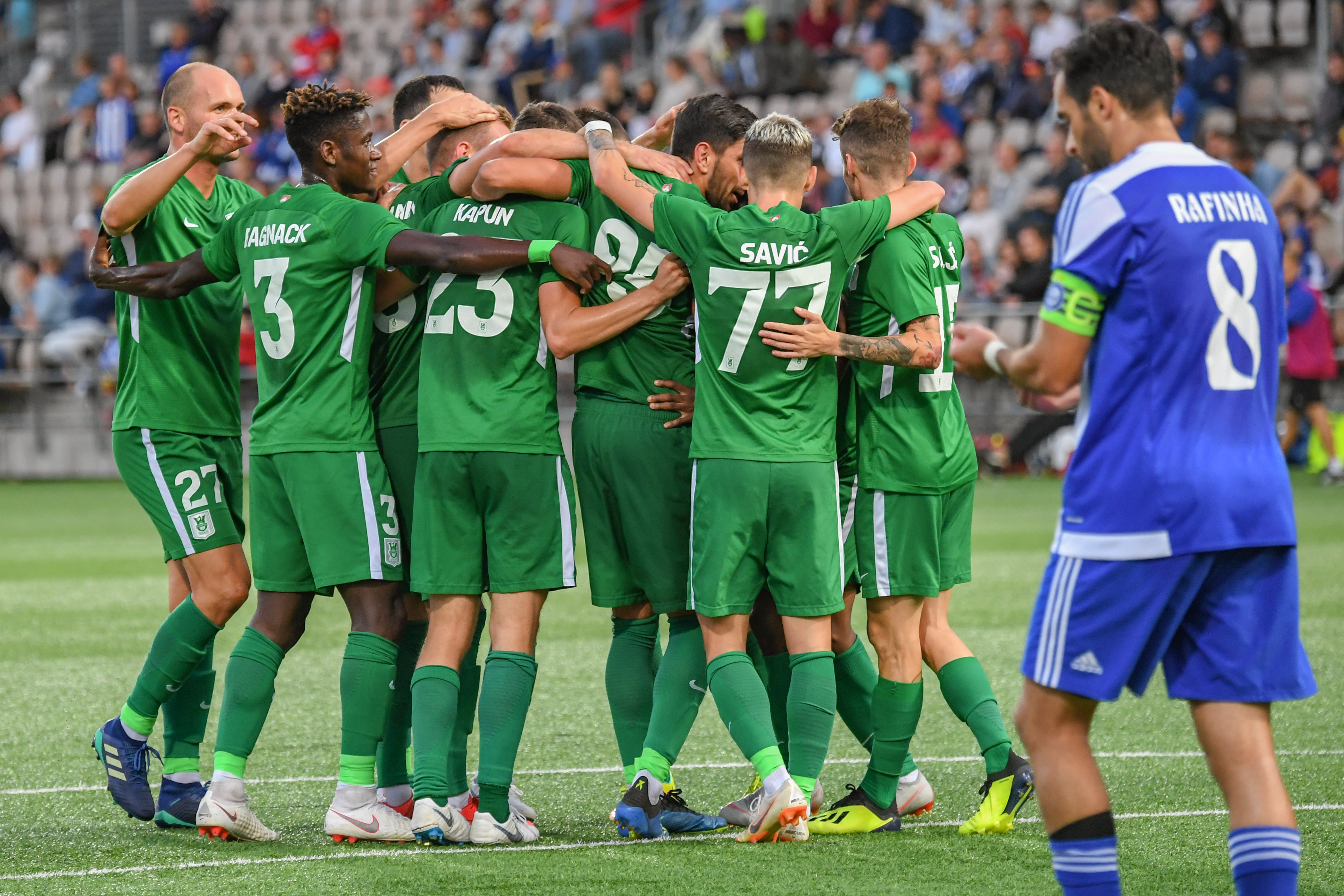 epa06953136 Players of Olimpija Ljubljana celebrate a goal during the UEFA Europa League third qualifying round second leg match between HJK and Olimpija Ljubljana in Helsinki, Finland 16 August 2018.  EPA-EFE/KIMMO BRANDT