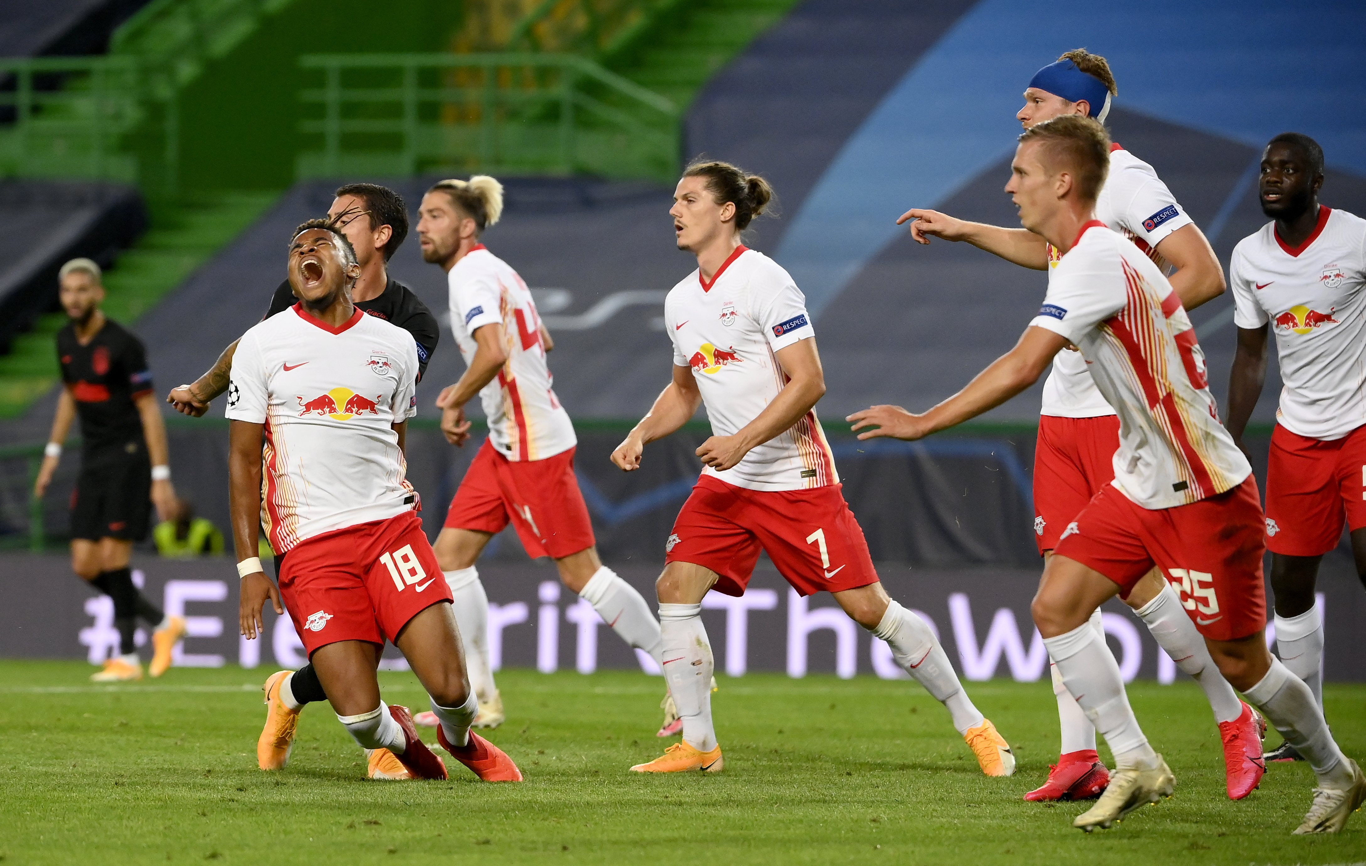 epa08601894 Christopher Nkunku (3-L0 of Leipzig reacts during the UEFA Champions League quarter final match between RB Leipzig and Atletico Madrid in Lisbon, Portugal, 13 August 2020.  EPA-EFE/Lluis Gene / POOL
