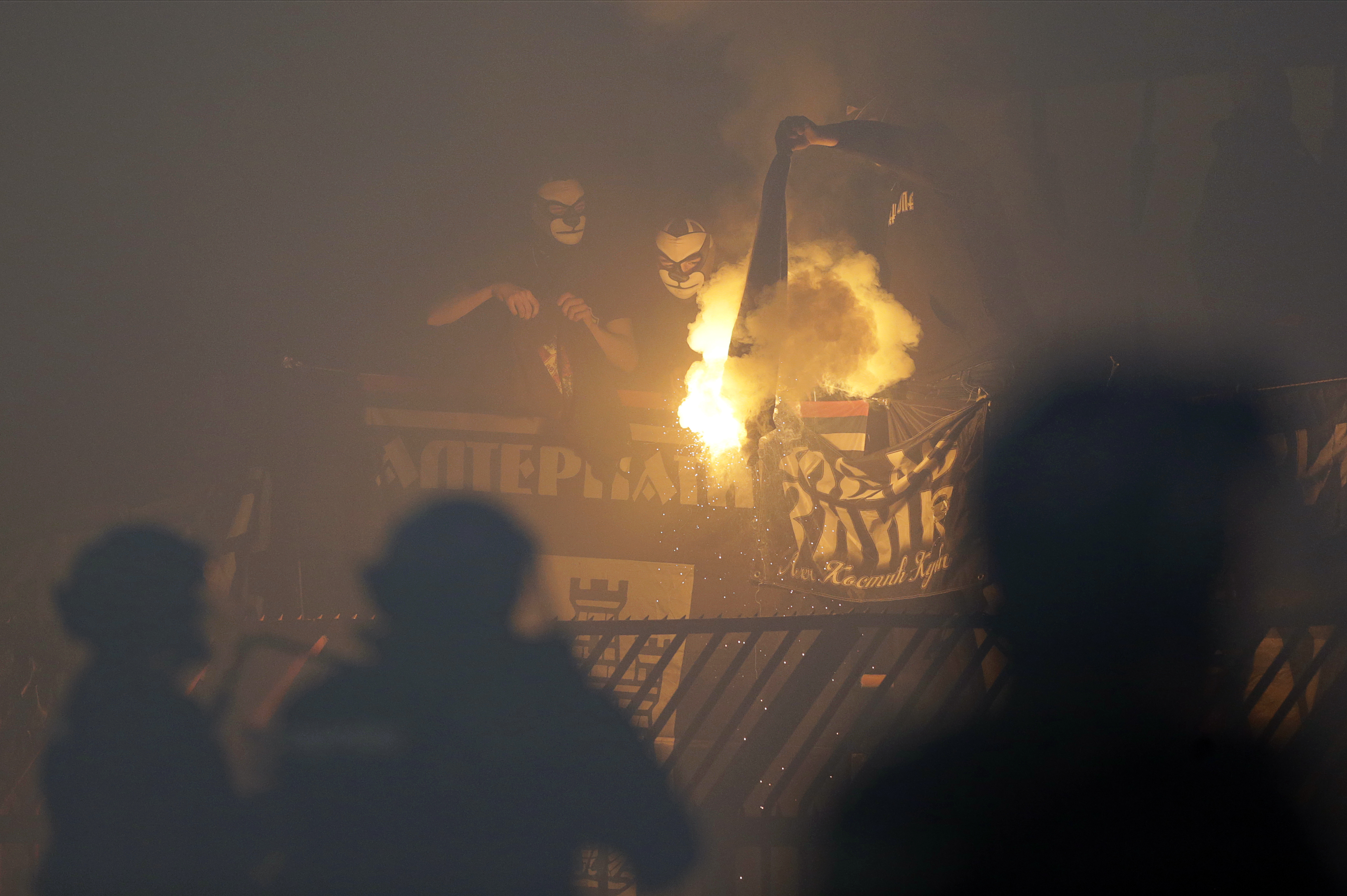 epa08263026 Supporters of Partizan burn a flag during the Serbian SuperLiga soccer derby match between Red Star and Partizan in Belgrade, Serbia, 01 March 2020.  EPA-EFE/ANDREJ CUKIC