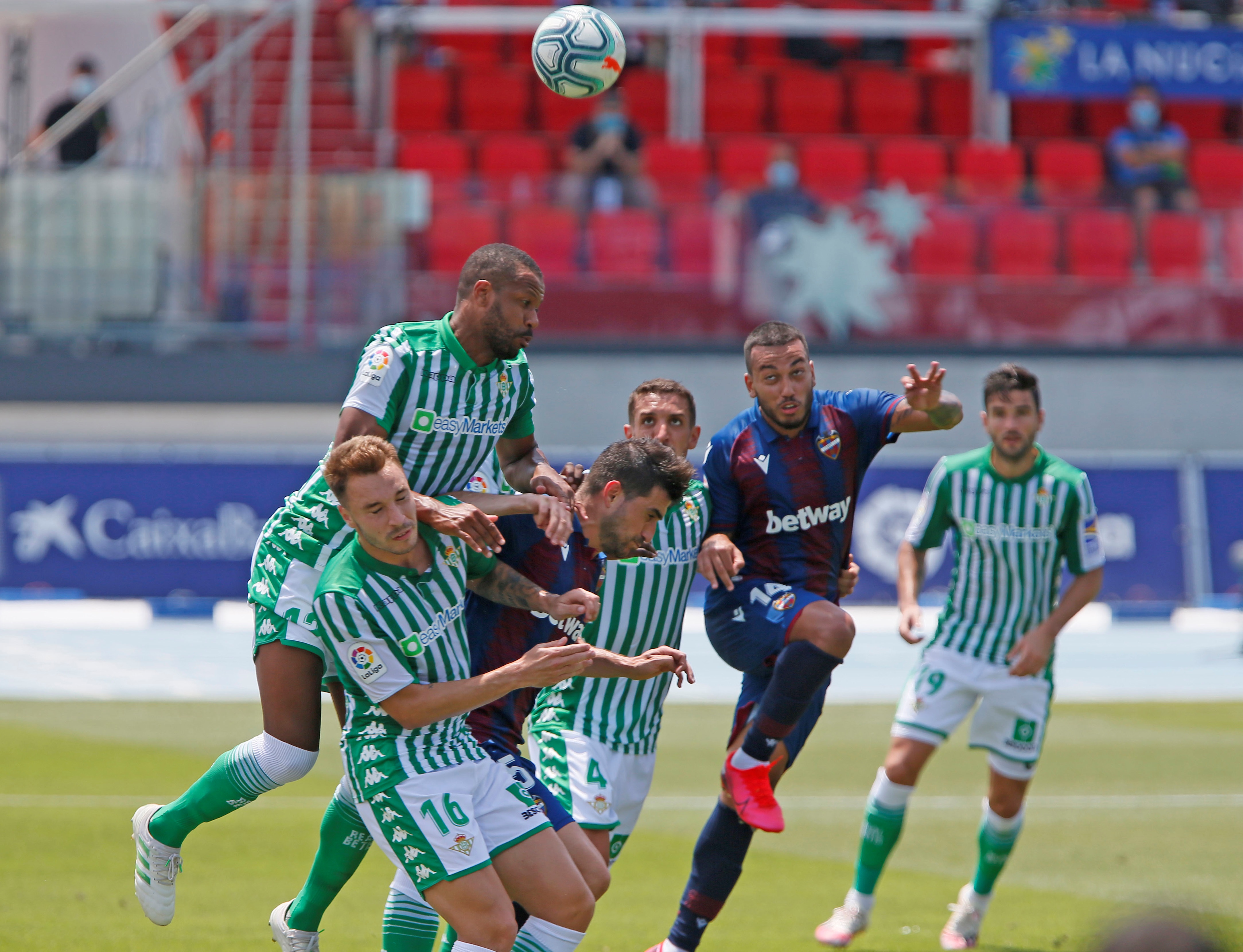 epa08514126 Levante's player Sidnei (top) in action during the Spanish Primera Division LaLiga match held between Levante UD and Real Betis at La Nucia stadium in Alicante, Valencia, Spain, 28 June 2020.  EPA-EFE/MANUEL LORENZO