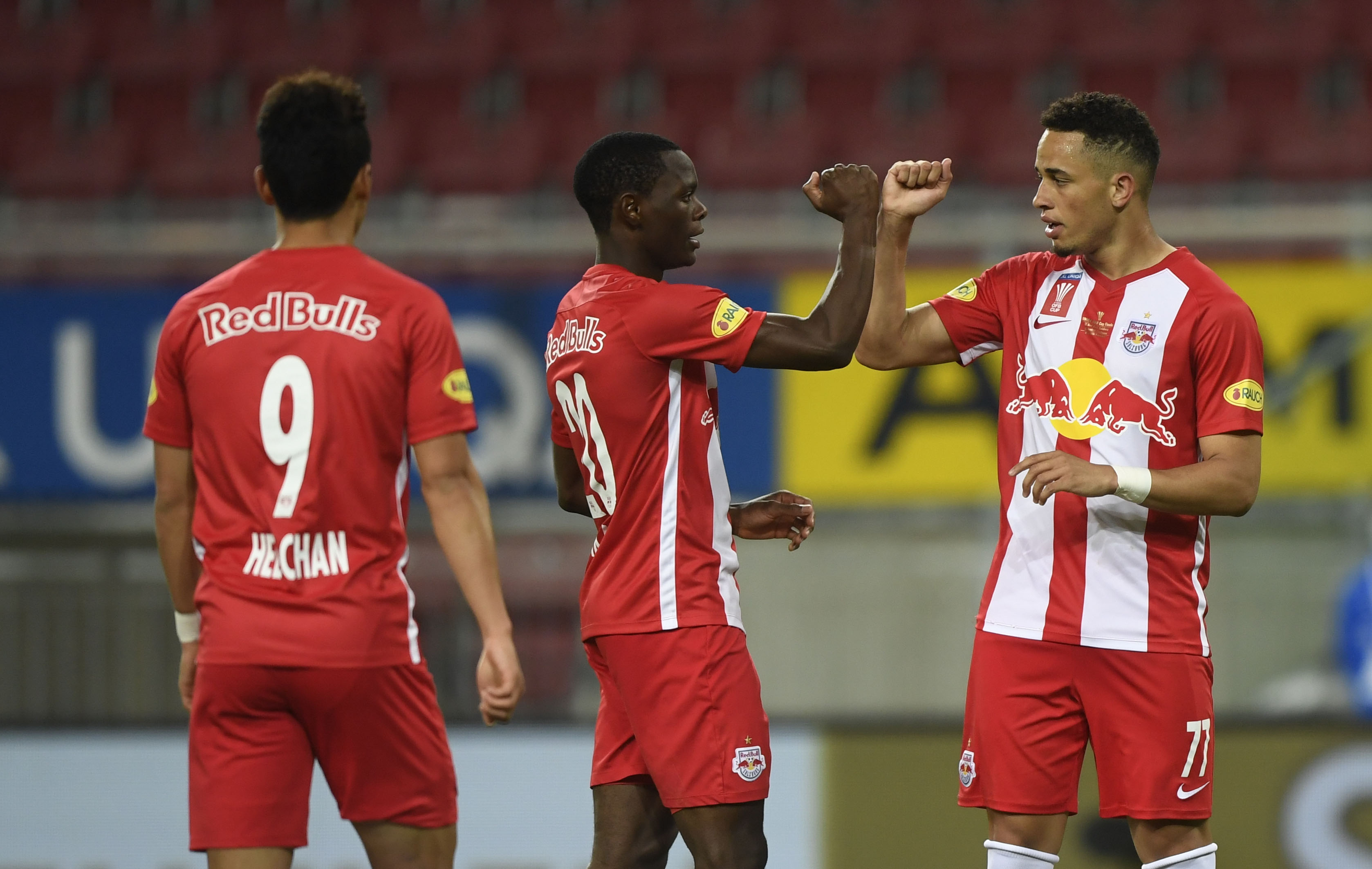 epa08453022 Salzburg's (L-R) Hee-chan Hwang, Patson Daka and Noah Okafor celebrate the 3-0 lead during the Austrian OEFB Cup Final soccer match between Red Bull Salzburg and Austria Lustenau in Klagenfurt, Austria, 29 May 2020.  EPA-EFE/CHRISTIAN BRUNA