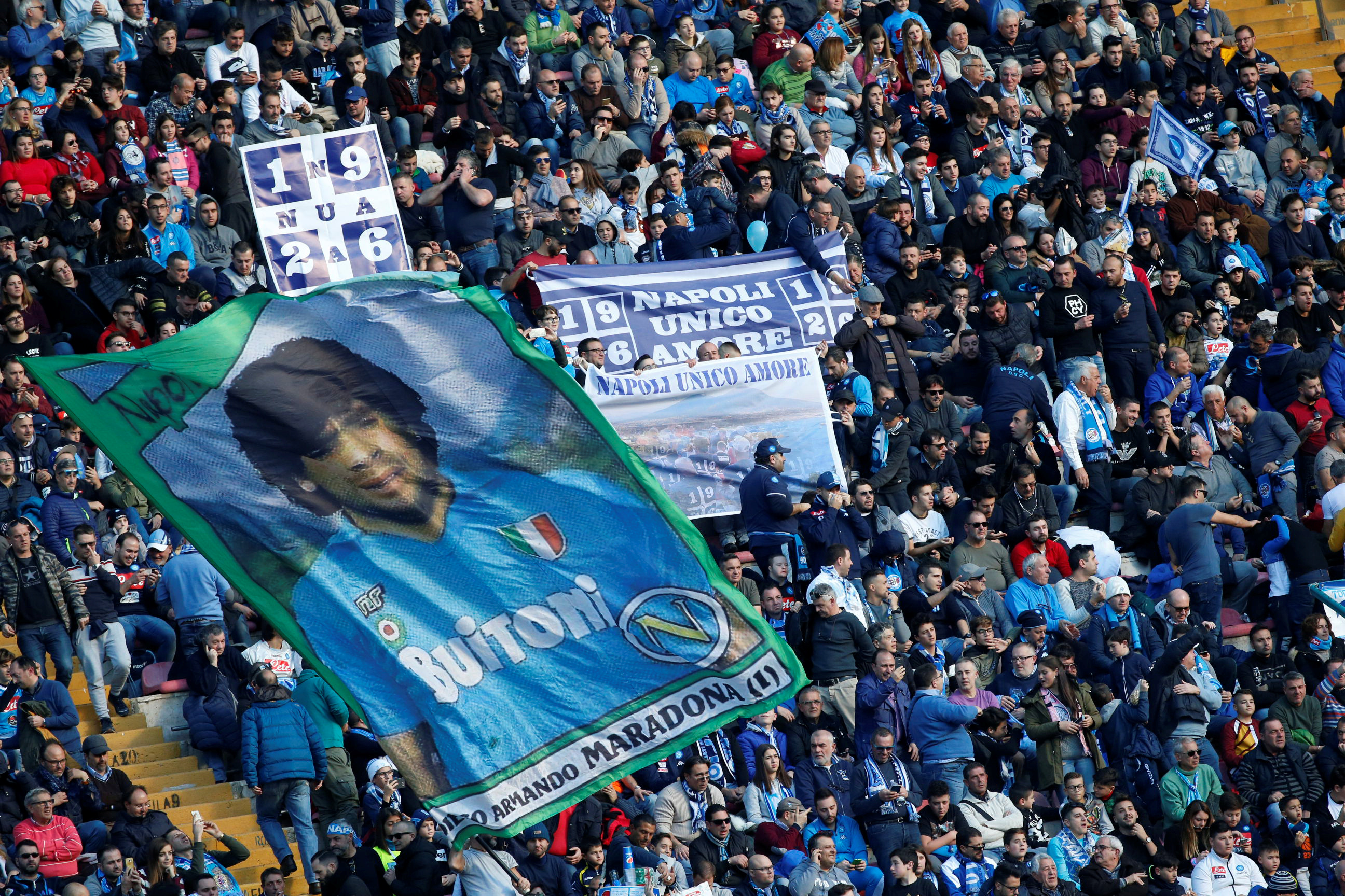 Soccer Football - Serie A - Napoli vs Sampdoria - Stadio San Paolo, Naples, Italy - December 23, 2017   Napoli fans display a banner for their former player Diego Maradona before the match    REUTERS/Ciro De Luca - RC18FE5DC300