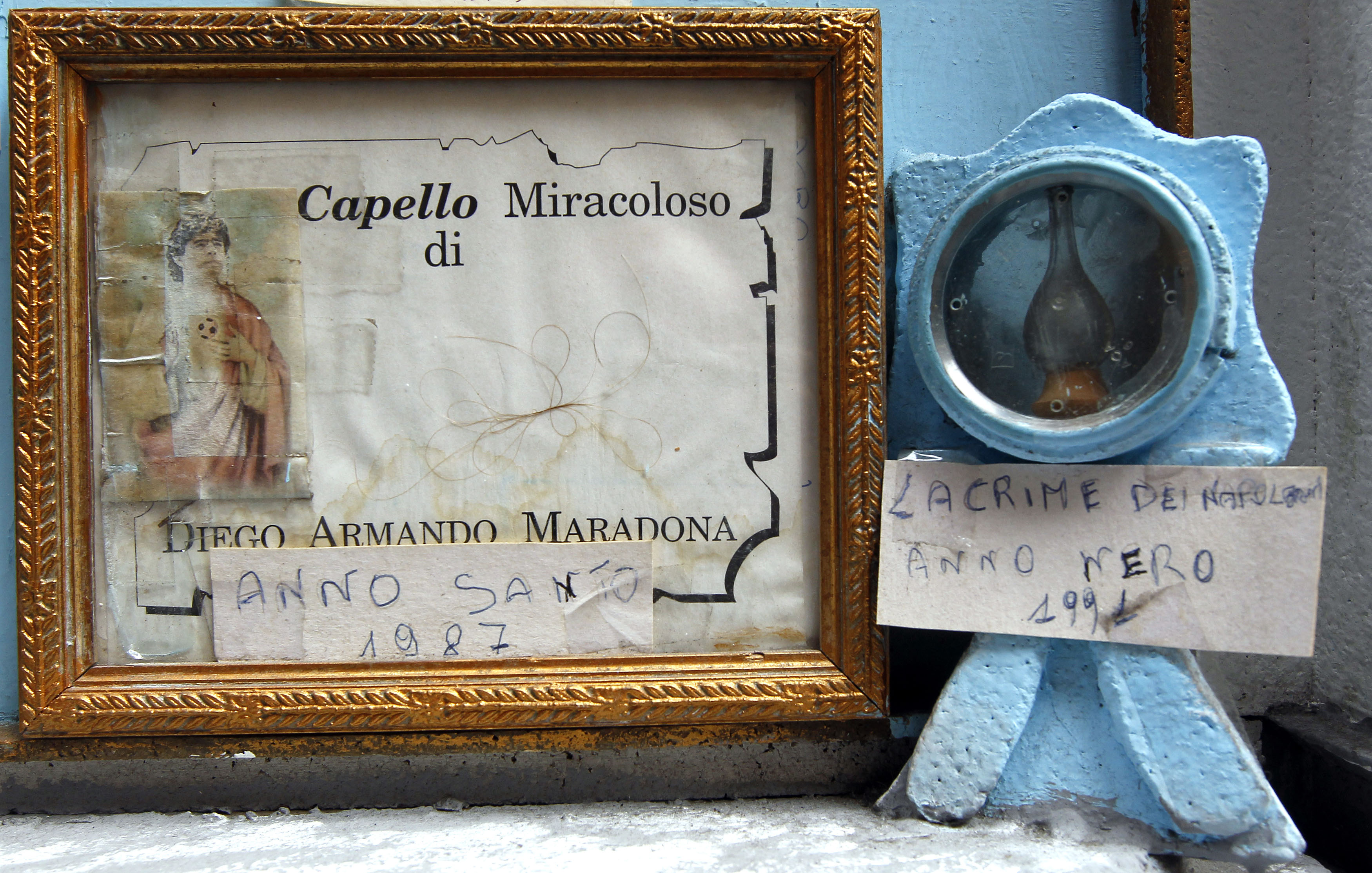 Hair believed to belong to former Argentina international and Napoli soccer player Maradona is displayed inside a small altar next to the Nilo bar in Naples