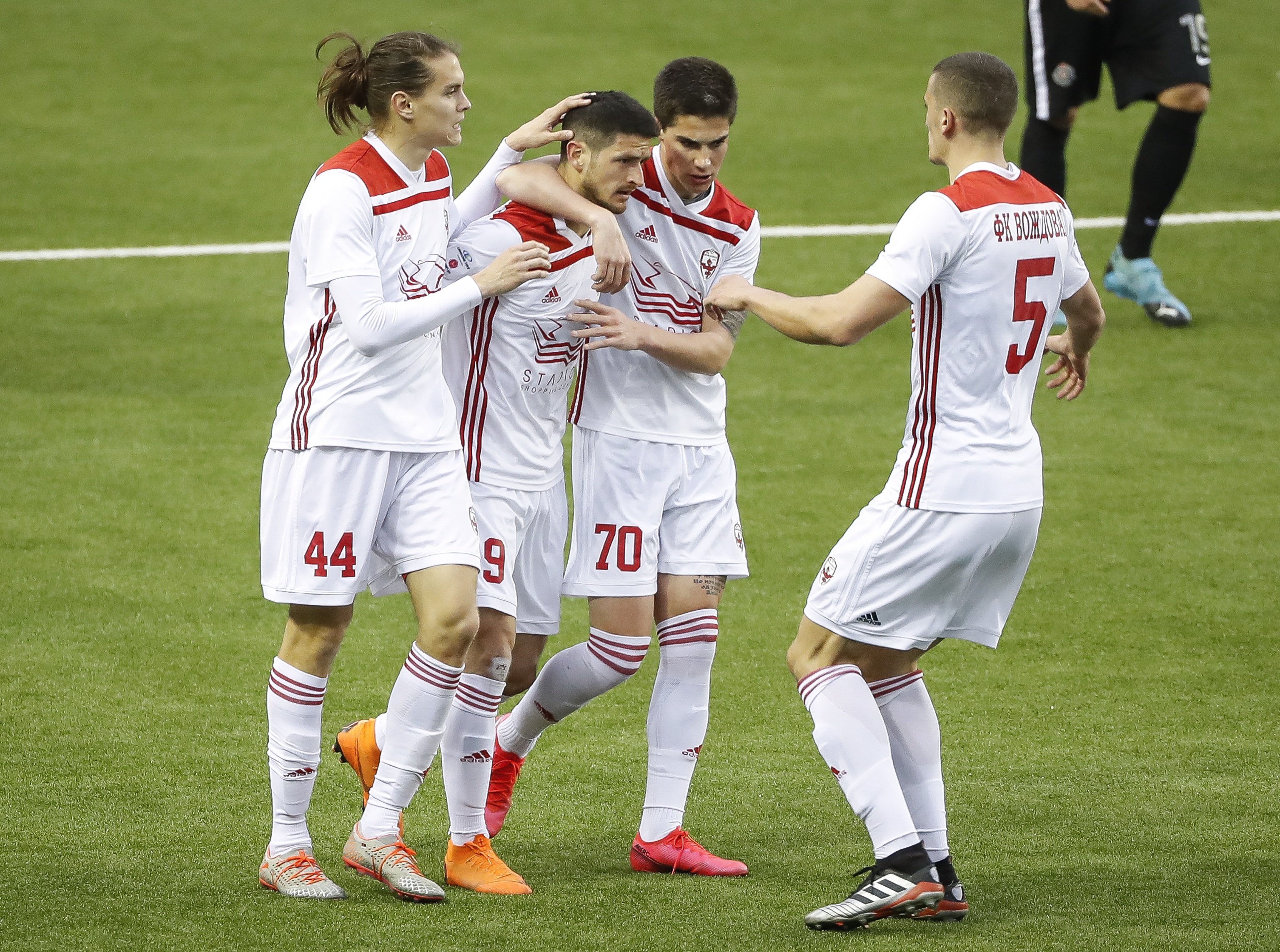 Fudbal Super League Season 2019-2020
Vozdovac v Partizan
Milos Stojcev (C) celebrates after scoring a goal with Stefan Hajdin Aleksa Jankovic and Nenad Cvetkovic (R)
Beograd, 14.03.2020.
foto: Srdjan Stevanovic/Starsportphoto ©