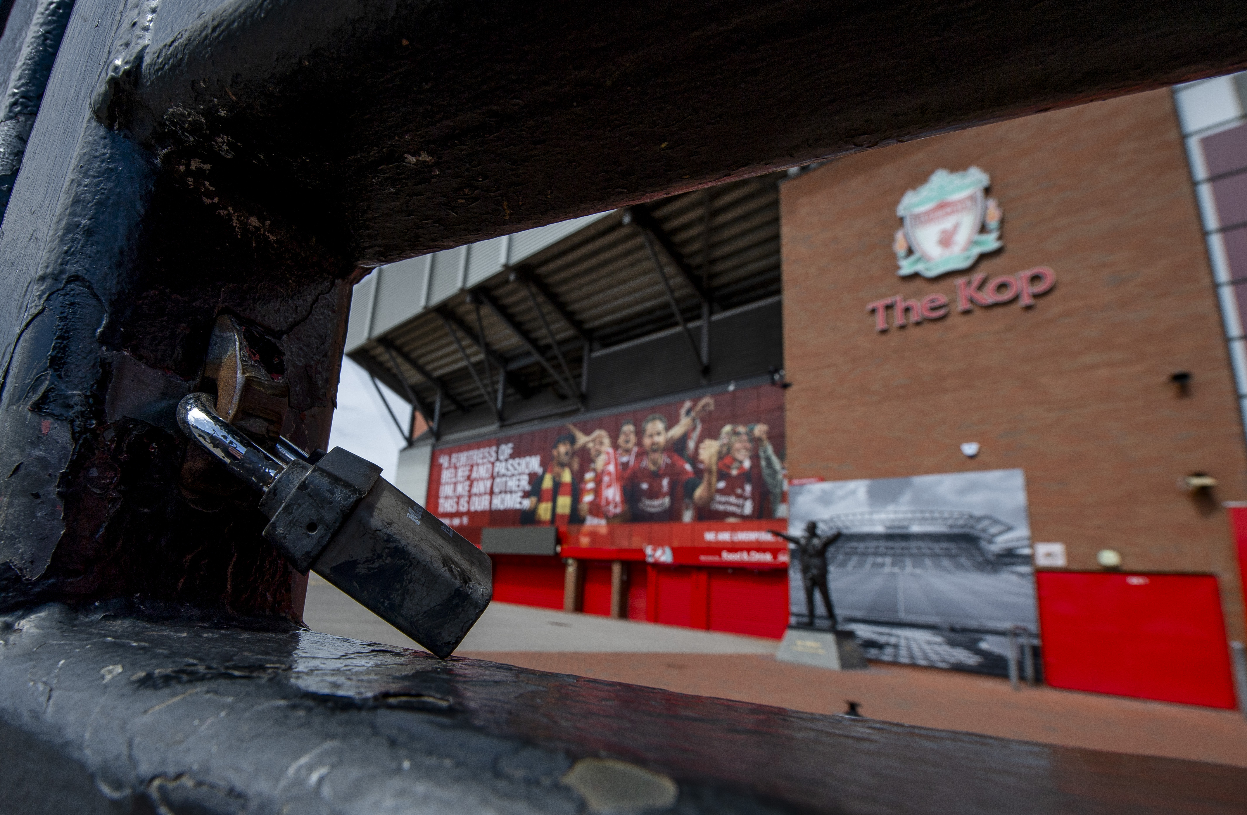 epa08440764 A general view of the locked gate outside the KOP stand at Liverpool FC Stadium, at Anfield, Liverpool, Britain, 23 May 2020. All matches from the English Premier League are postponed due to the Coronavirus outbreak.  EPA-EFE/PETER POWELL