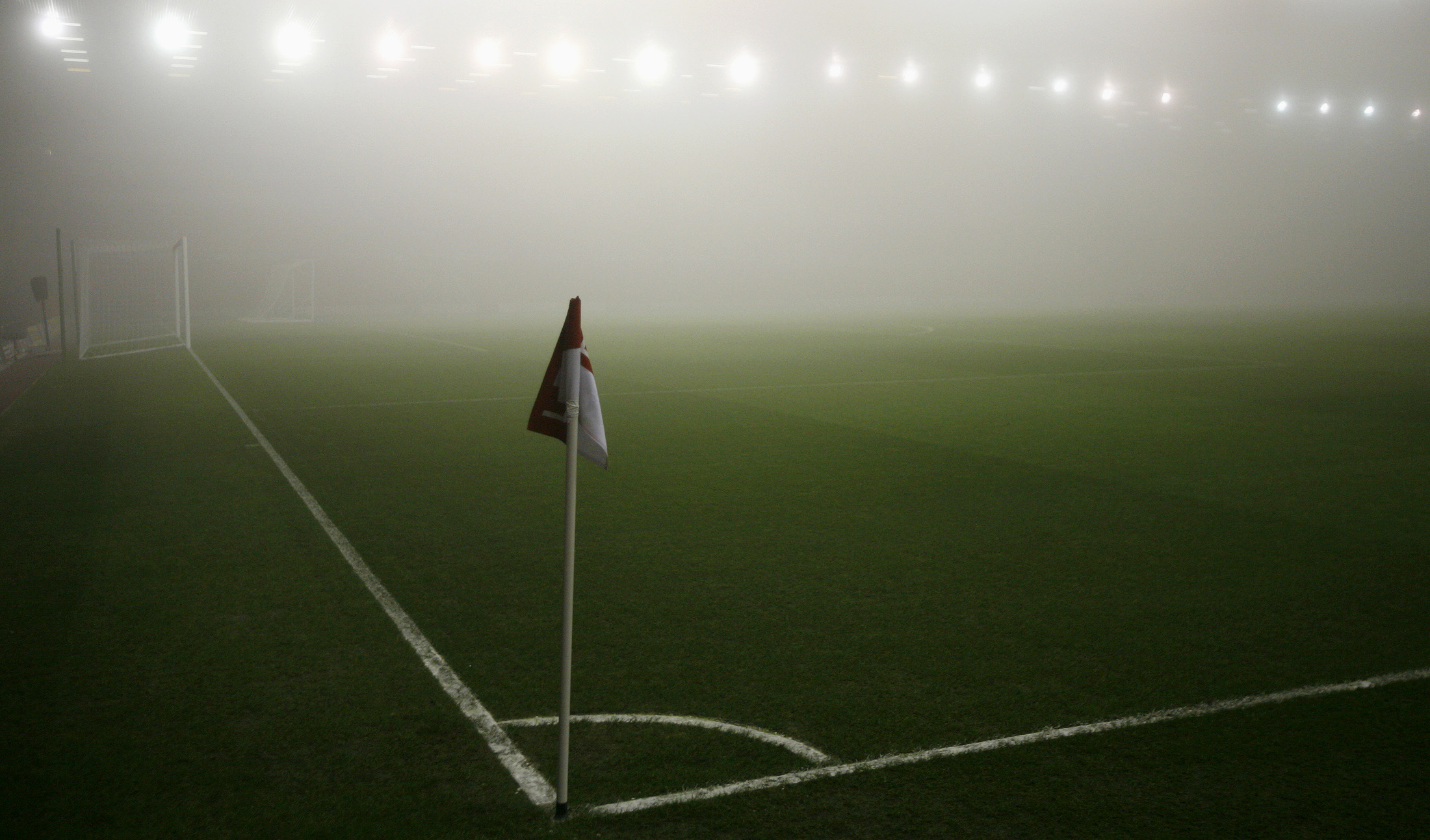 Heavy fog covers pitch ahead of English League Cup quarter-final soccer match between Liverpool and Arsenal at Anfield in Liverpool