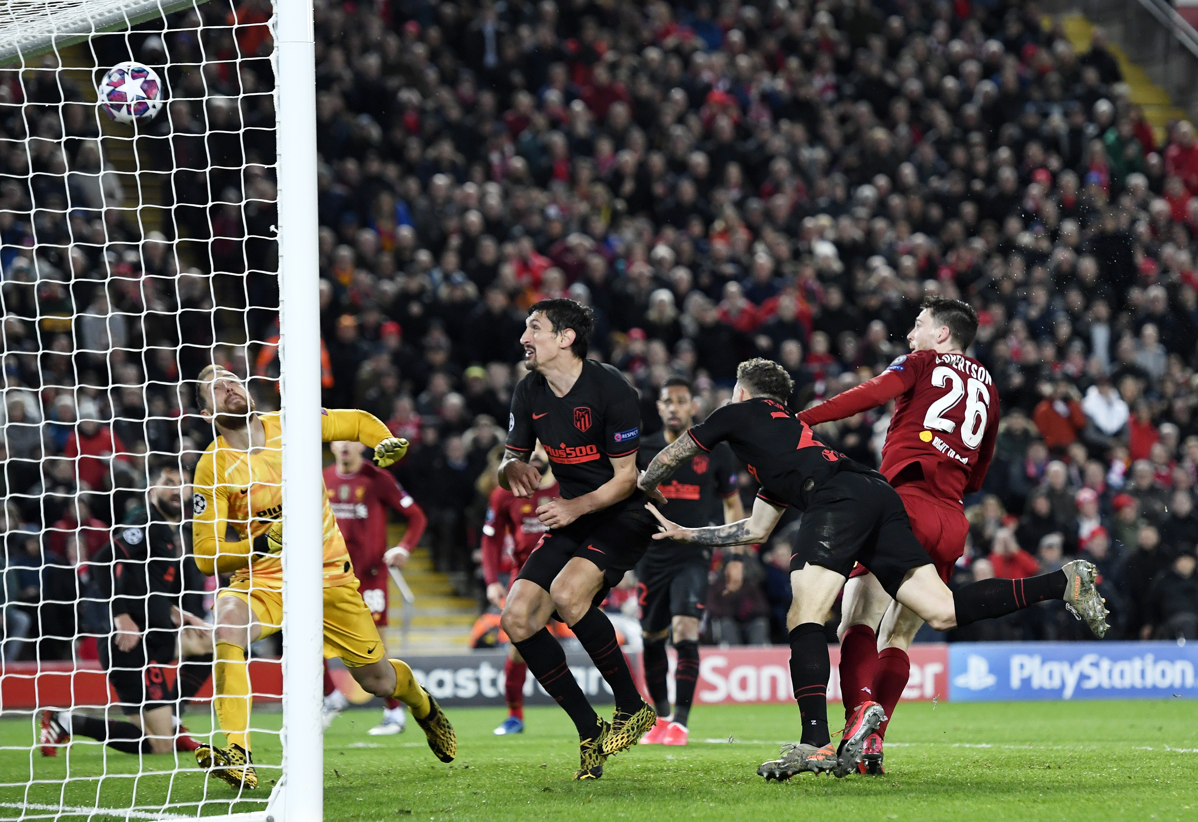 epa08287452 Andy Robertson (R) of Liverpool hits the cross bar during the UEFA Champions League Round of 16, second leg match between Liverpool FC and Atletico Madrid in Liverpool, Britain, 11 March 2020.  EPA-EFE/PETER POWELL