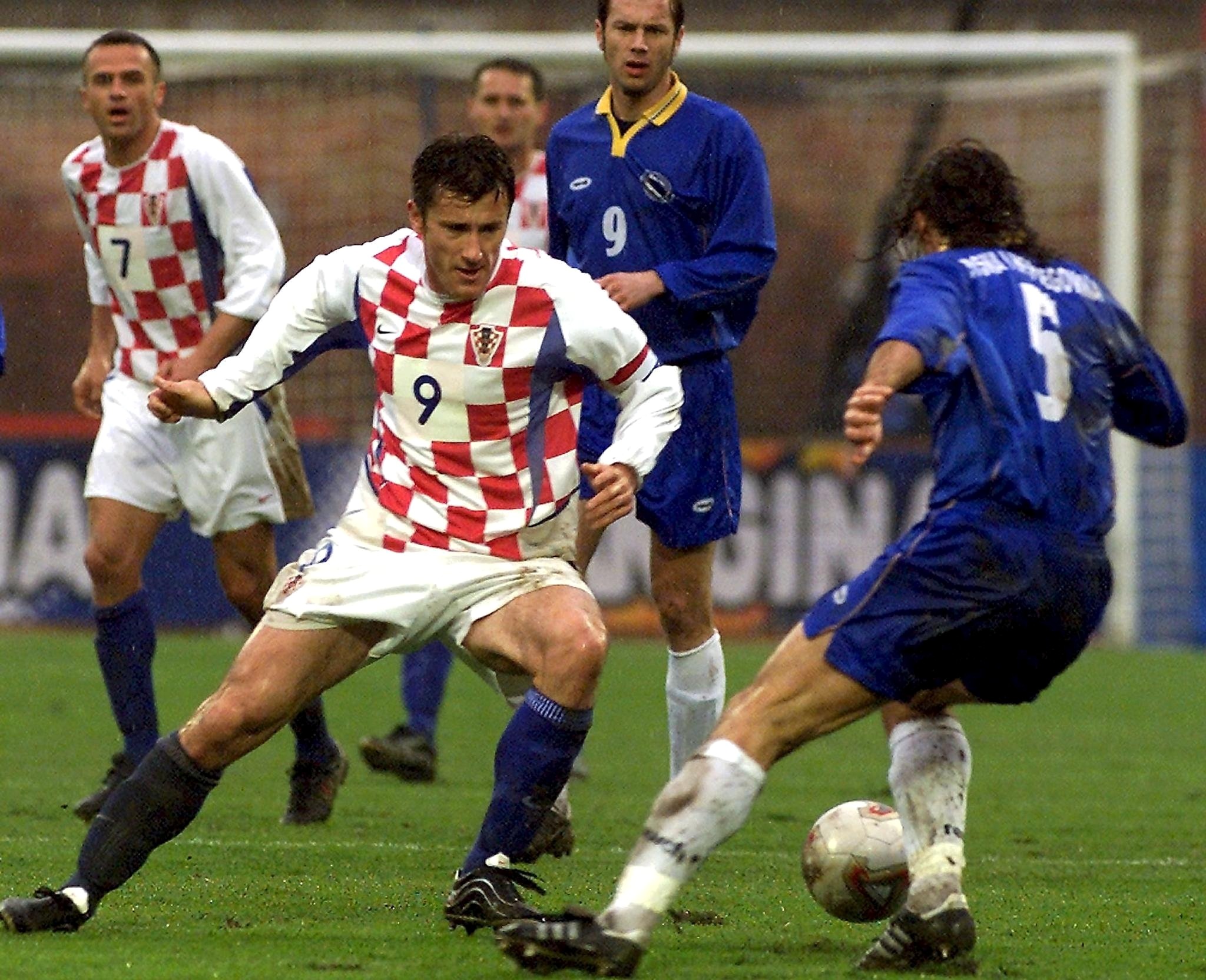 ZAG02 - 20020417 - ZAGREB, CROATIA: Davor Suker (L) of Croatia takes on Bruno Akrapovic (R) of Bosnia-Herzegovina during the friendly soccer match in Zagreb on Wedensday, 17 April 2002.