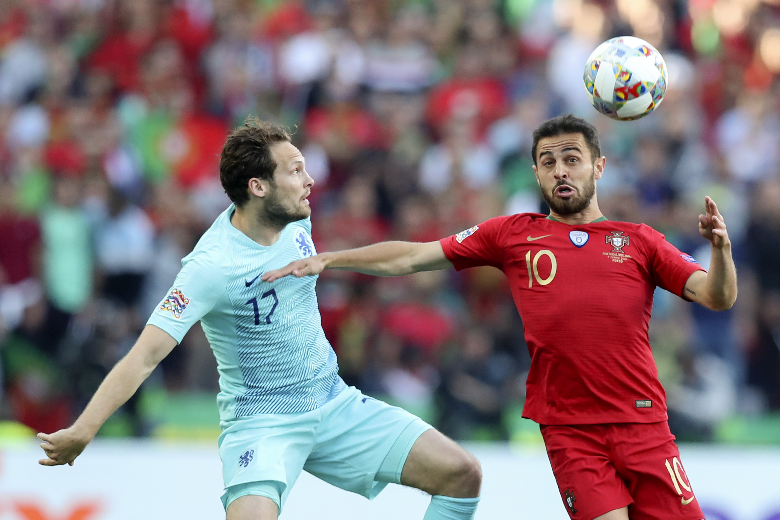 epa07637624 Portugal player Bernardo Silva (R) in action against Netherlands Daley Blind during the UEFA Nations League final soccer match Portugal vs Netherlands at Dragao stadium, Porto, Portugal, 09 June 2019.  EPA-EFE/JOSE COELHO