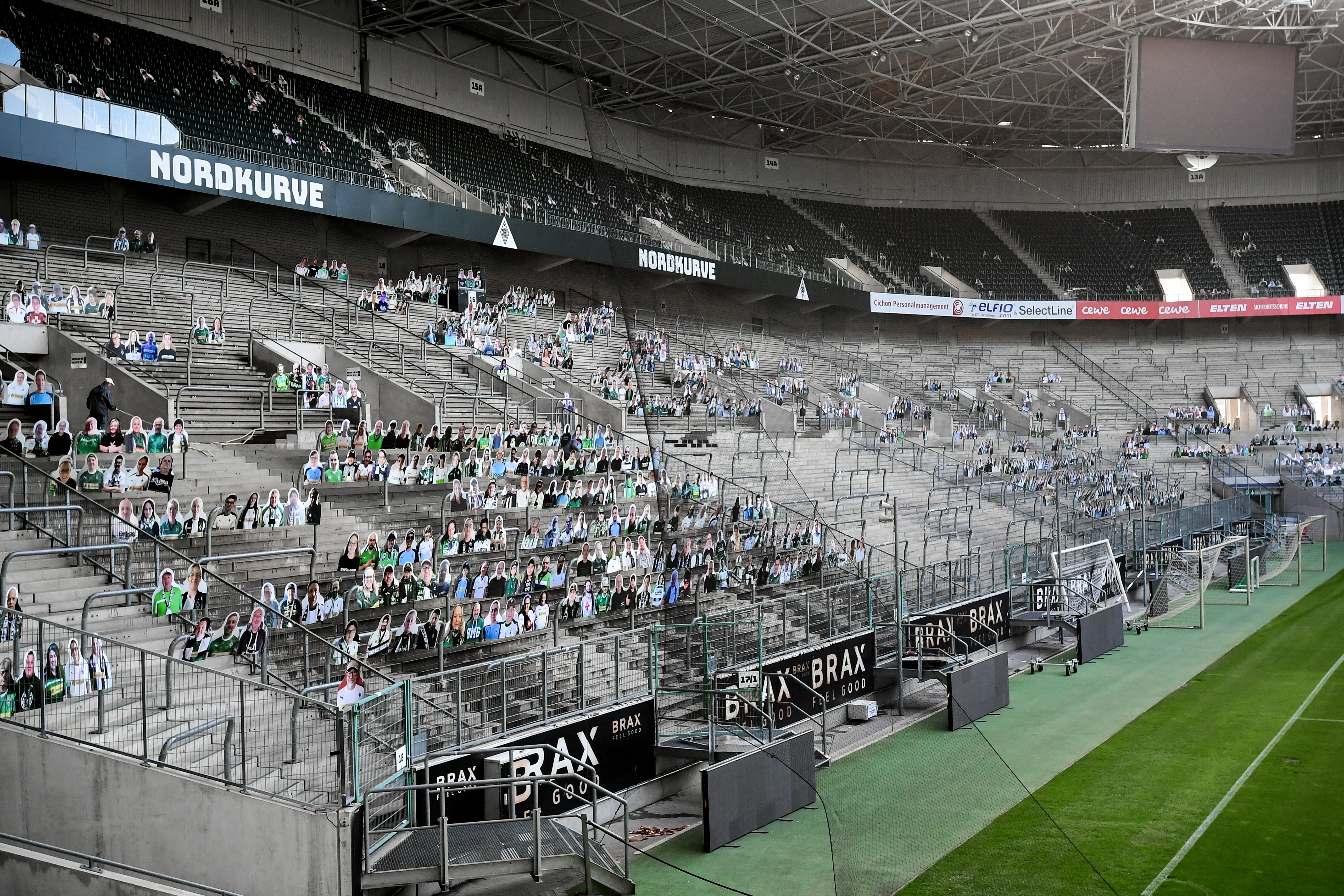 Cardboard cutouts replace supporters at empty soccer stadium in Germany