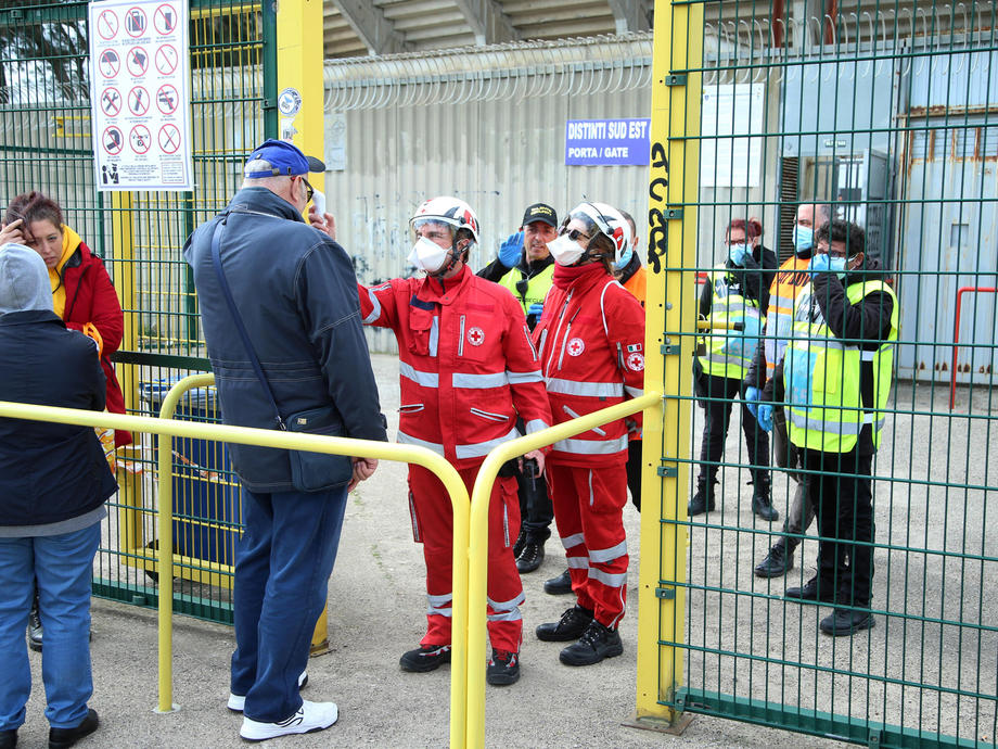 epa08261965 Italian Red Cross members check the temperature of Atalanta supporters before the Italian Serie A soccer match US Lecce vs Atalanta at the Via del Mare stadium in Lecce, Italy, 01 March 2020.  EPA-EFE/MARCO LEZZI
