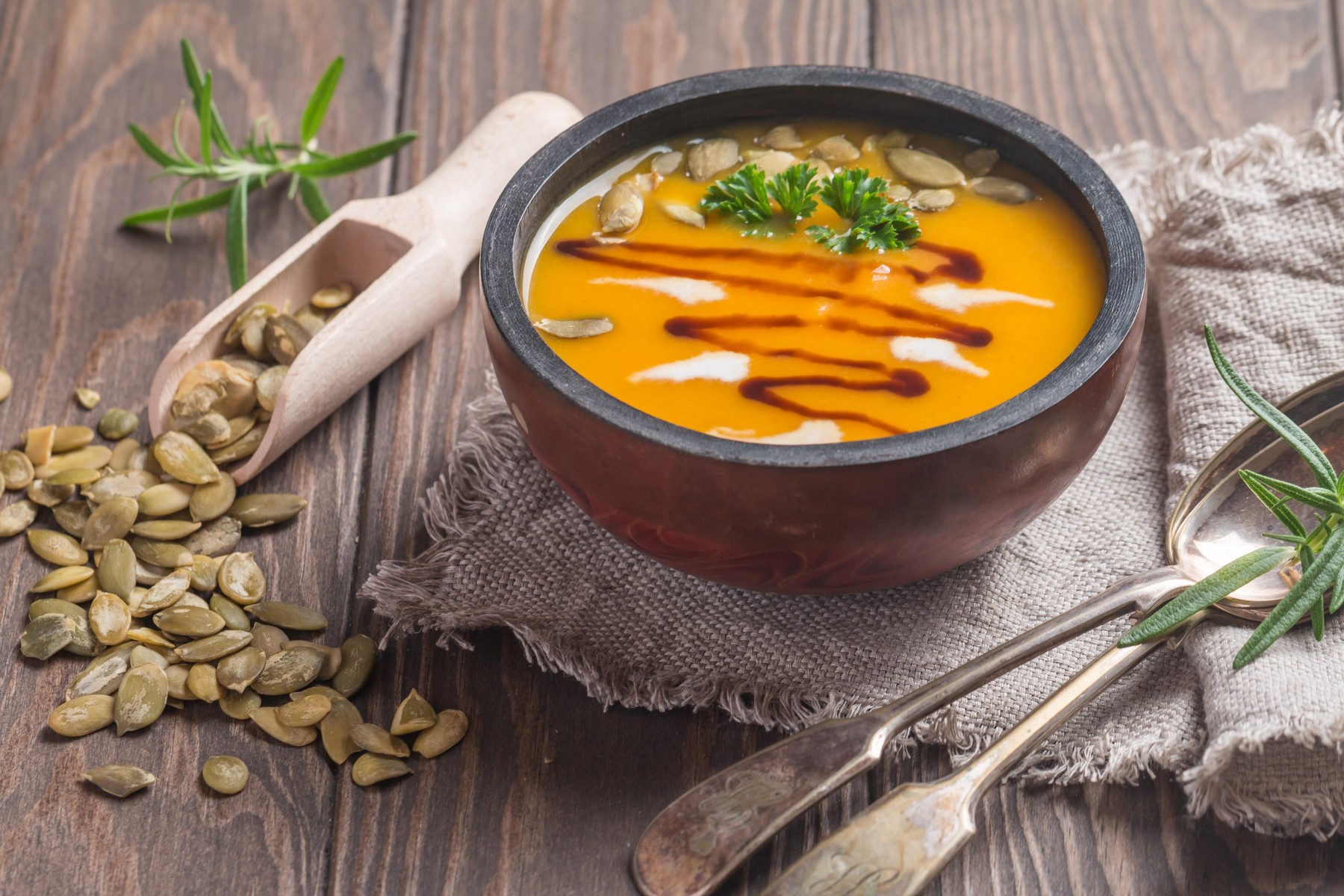 Roasted pumpkin soup with balsamic and pumpkin seeds on wooden background, close up,Image: 298780026, License: Royalty-free, Restrictions: , Model Release: no, Credit line: Petr Goskov / Alamy / Alamy / Profimedia