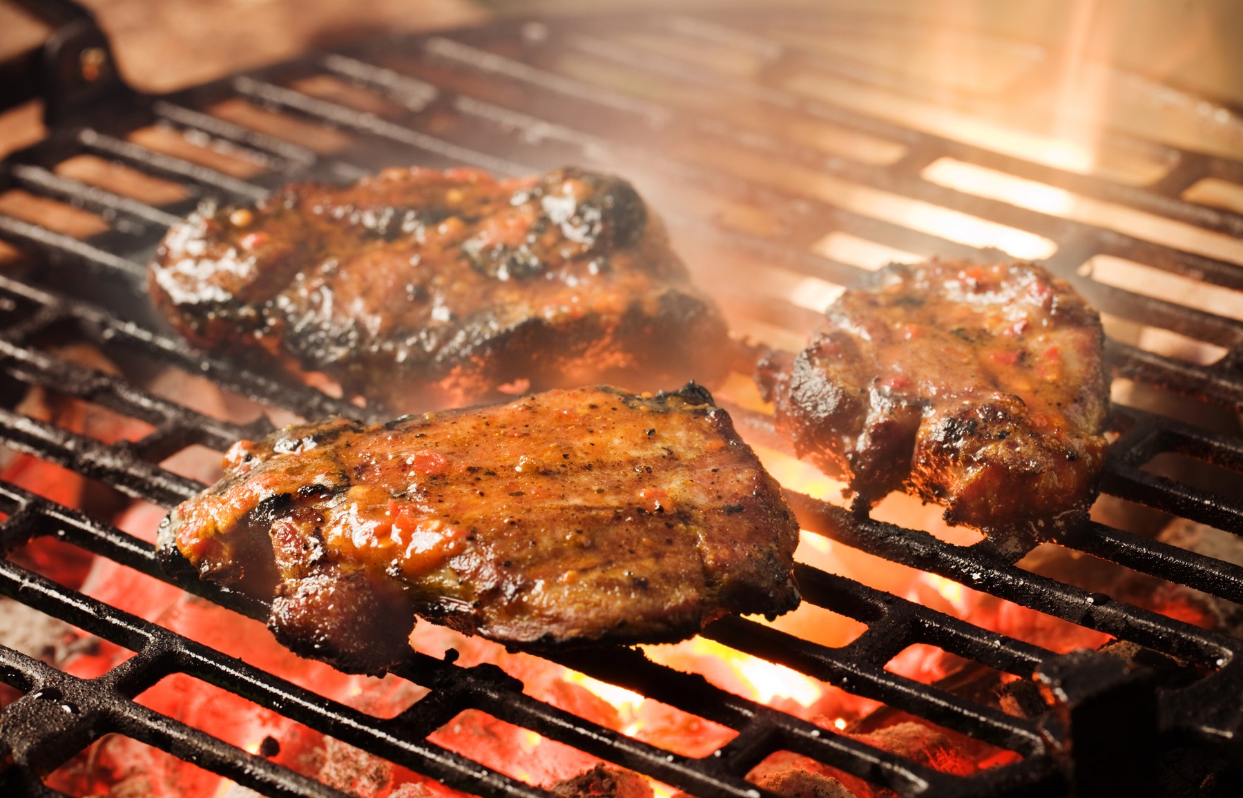 Grilling marinated meat on a charcoal grill,Image: 131450691, License: Rights-managed, Restrictions: , Model Release: no, Credit line: - / Digifoodstock / Profimedia
