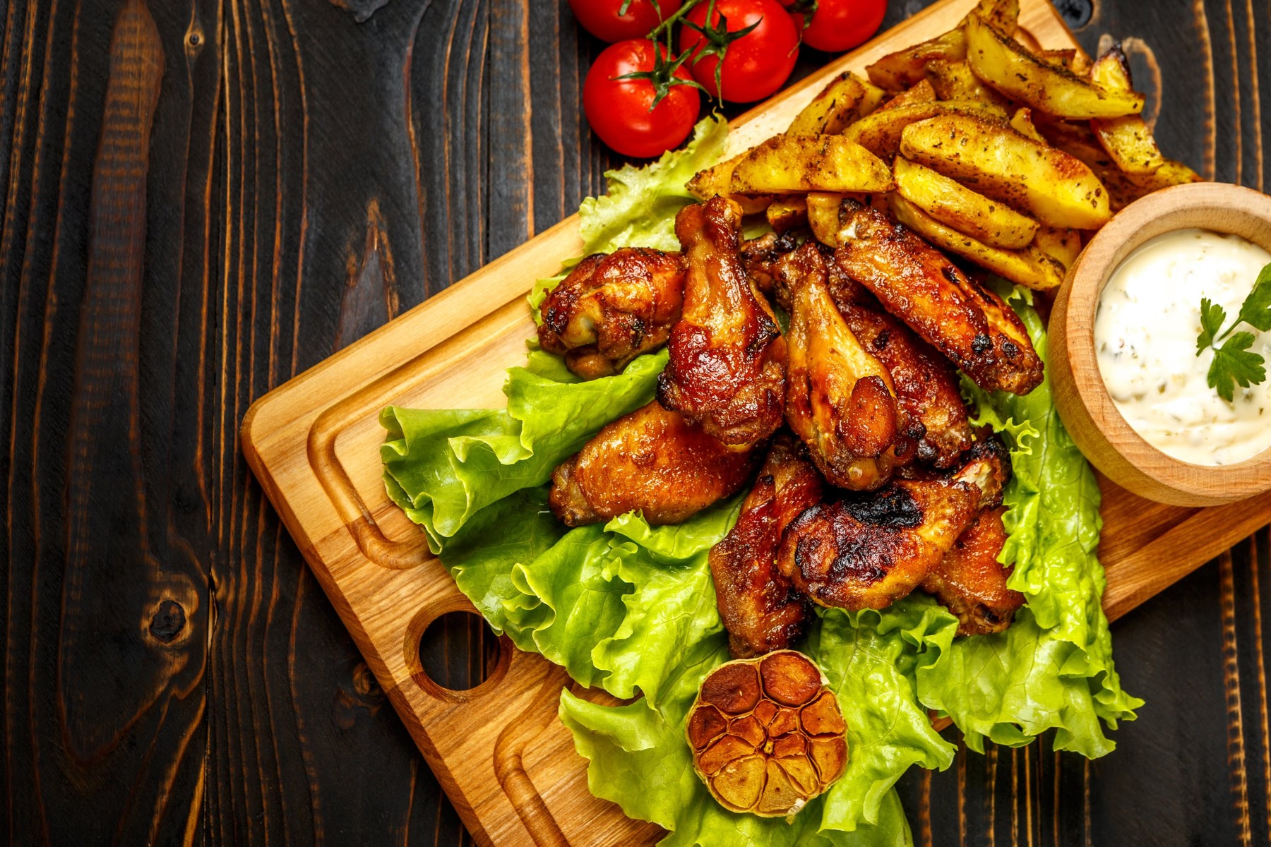 roasted chicken wings with herbs on wooden table,Image: 318418076, License: Royalty-free, Restrictions: , Model Release: no, Credit line: Anatolii Riepin / Alamy / Alamy / Profimedia