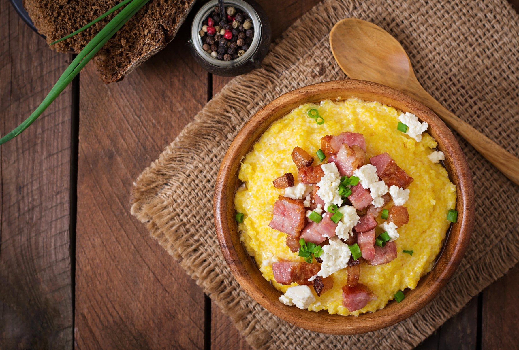 Banosh - Ukrainian Hutsul meal (maize porridge) with bacon, cracklings and cheese. Top view