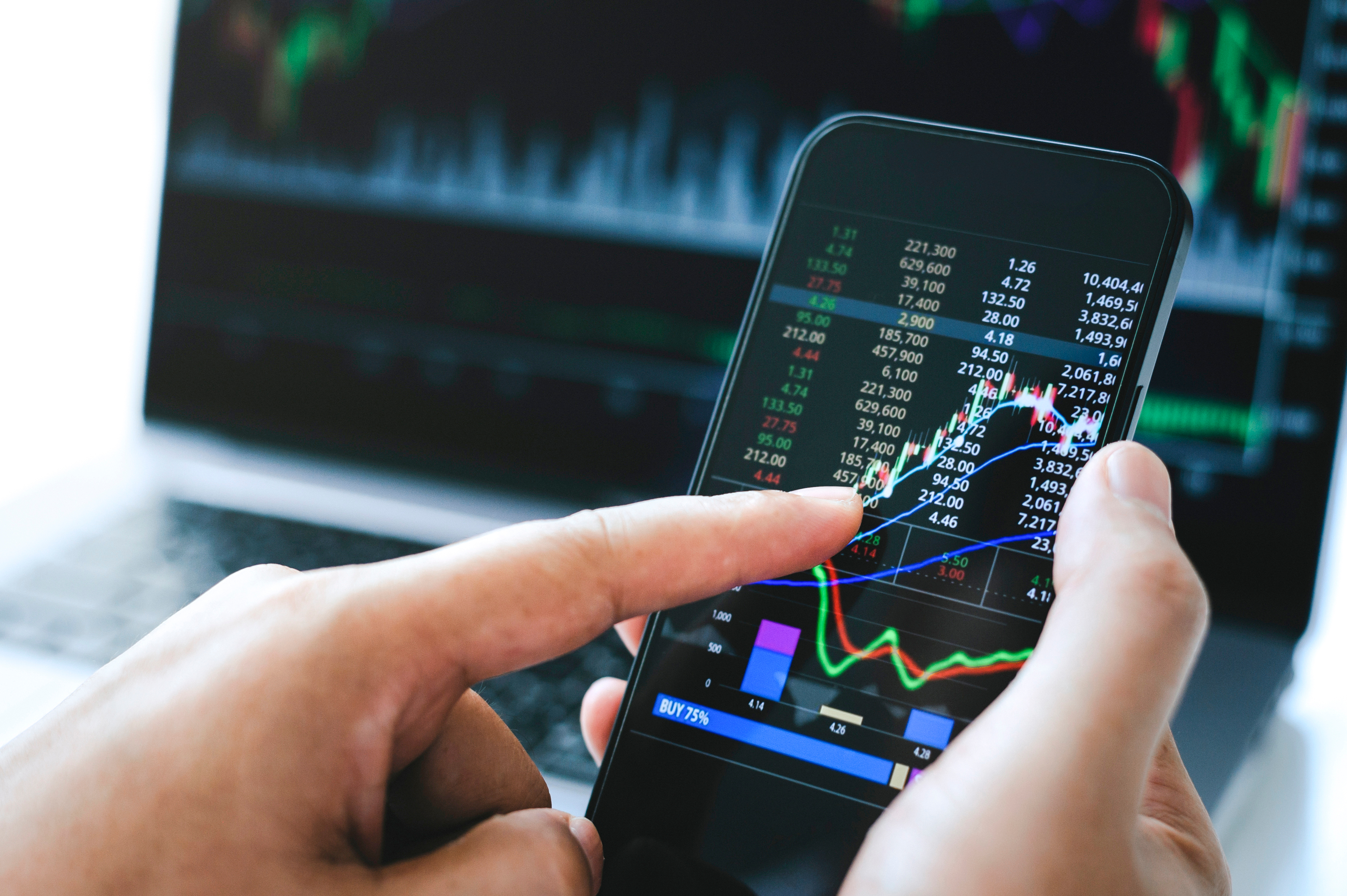 Businessman,Hand,Holding,Phone,And,Analysis,Finance,Market,Graph,Stock