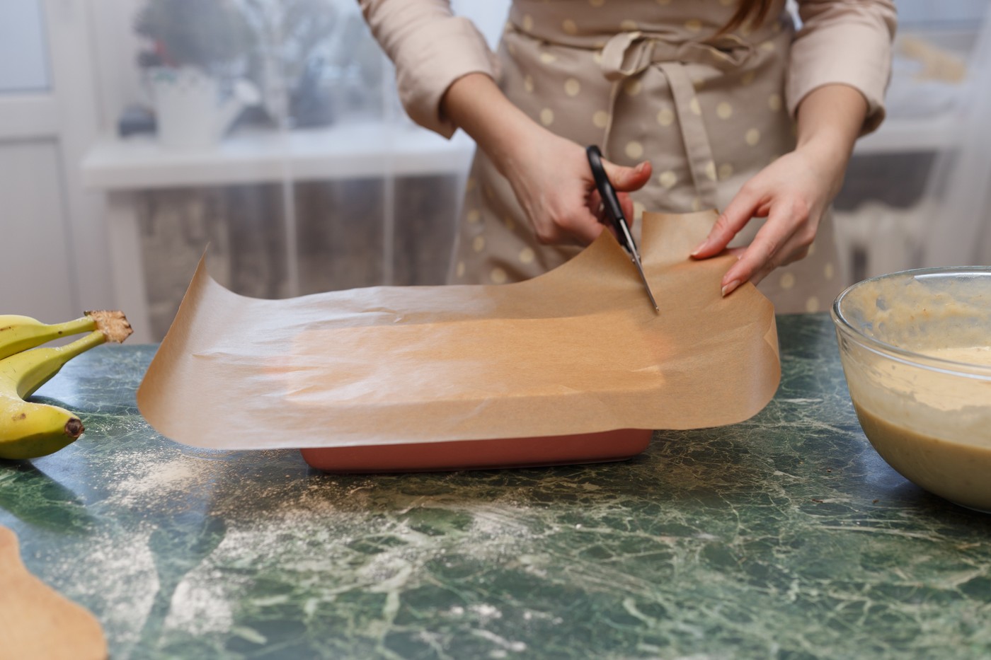 Woman cut baking paper for ceramic form,  cooking baking,Image: 595275693, License: Royalty-free, Restrictions: , Model Release: no, Credit line: Uladzislau Salikau / Panthermedia / Profimedia