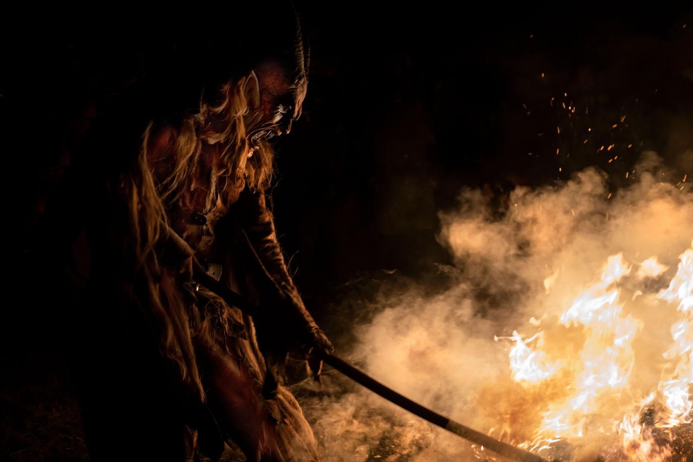 The Krampus masks in an exhibition in the night in Tarvisio, Italy