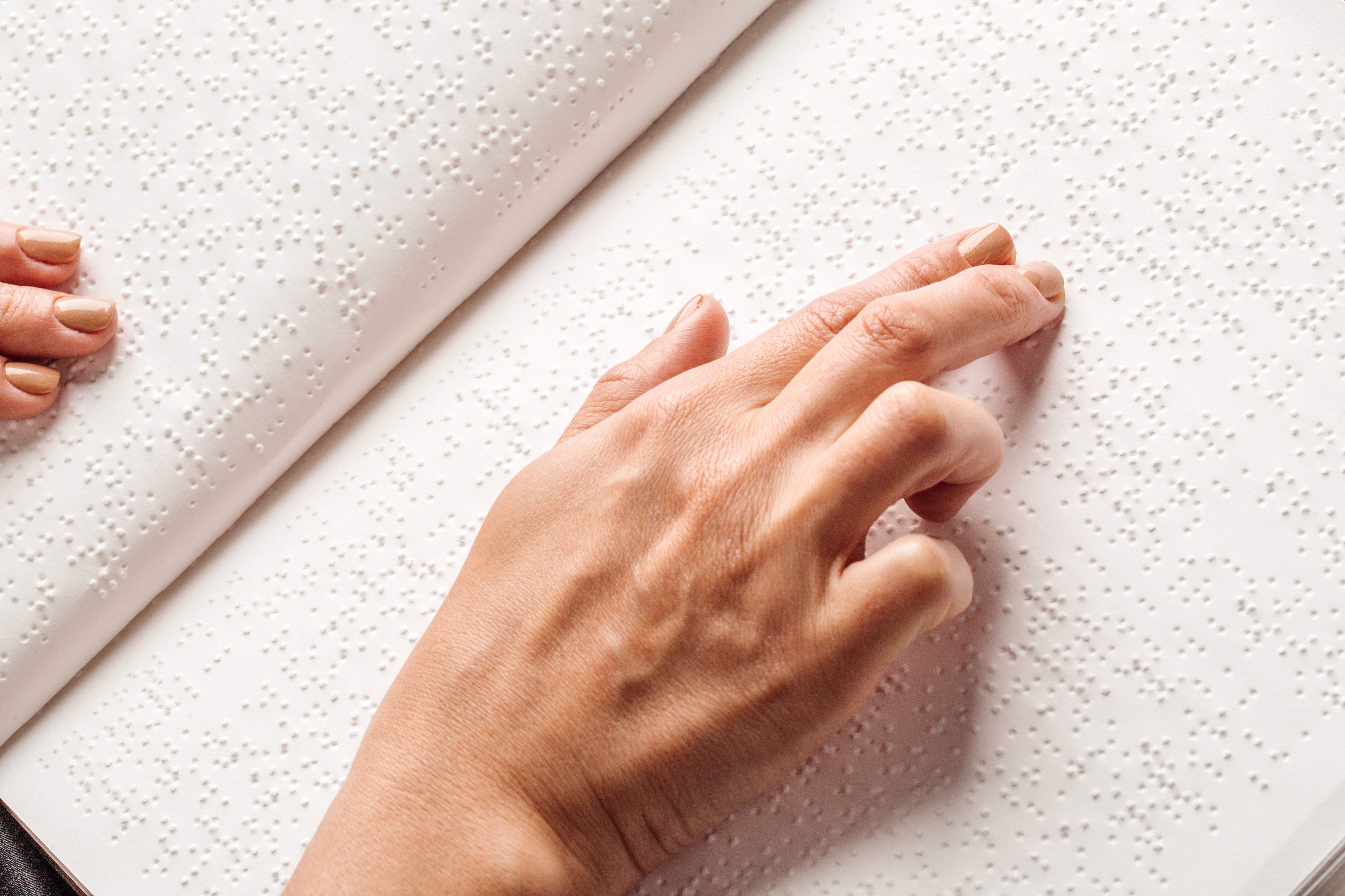 Blind,Woman,Read,Book,Written,In,Braille.,Close,Up,Finger